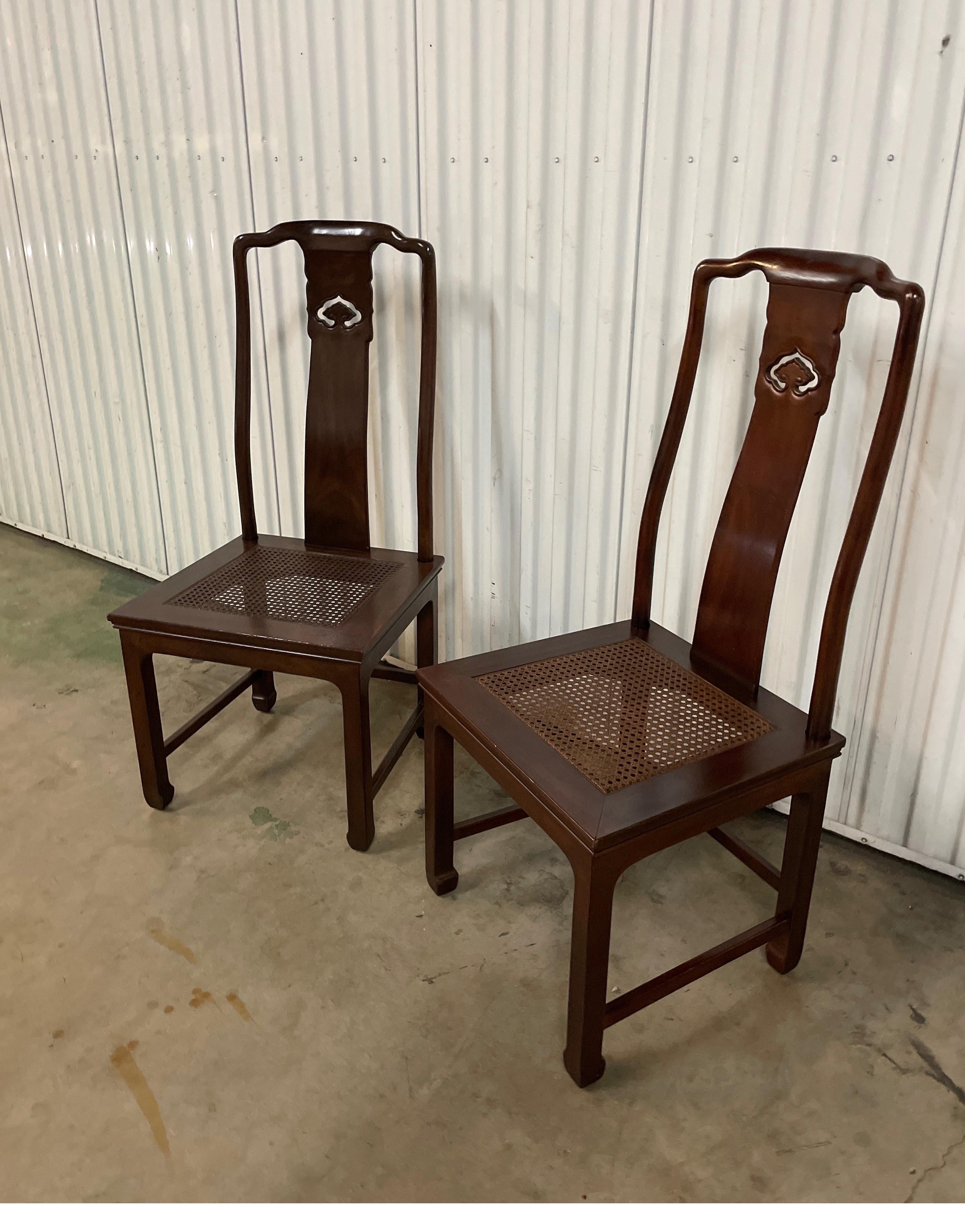 Pair of vintage Henredon Ming Dynasty style side chairs with cane seats.