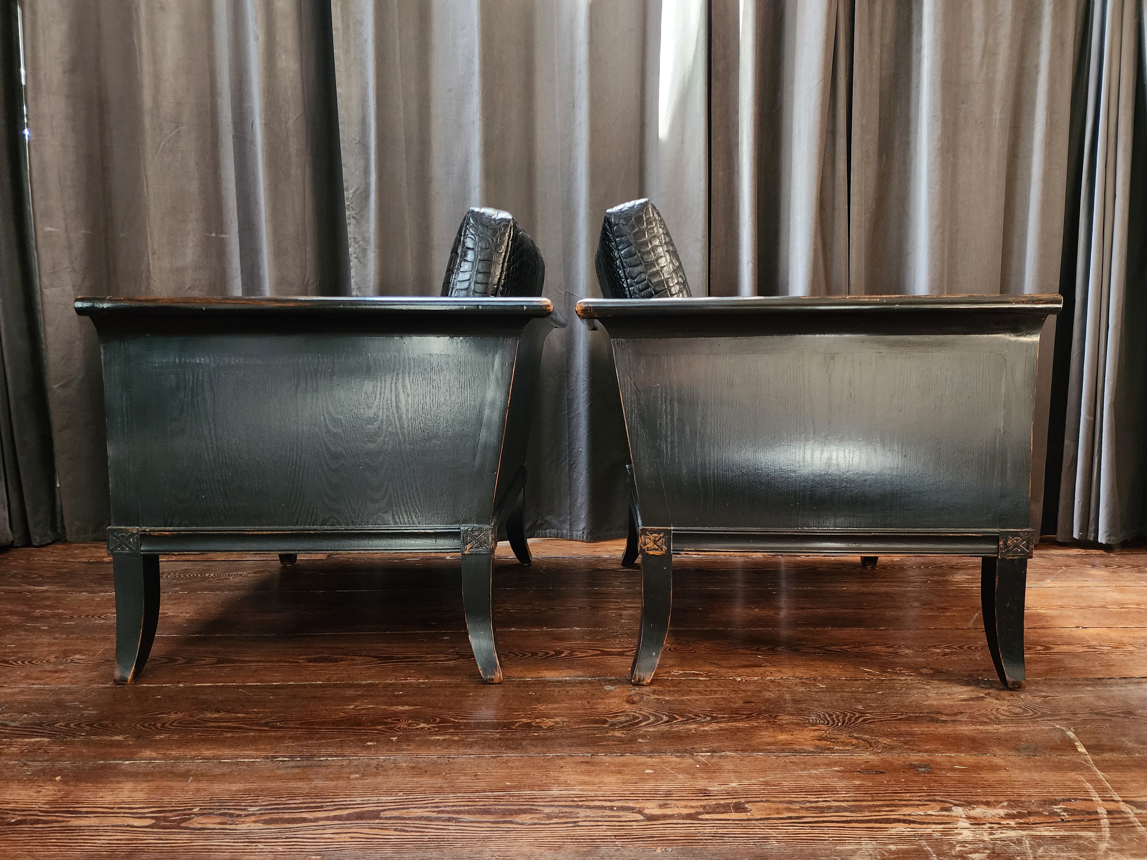 A spectacular and chic pair of Ming Style armchairs with embossed leather seats. Made from extremely hardwood with a gorgeous weathered petina through the ebony glaze.
The alligator in boss leather is beautiful and new.
These chairs present a lot