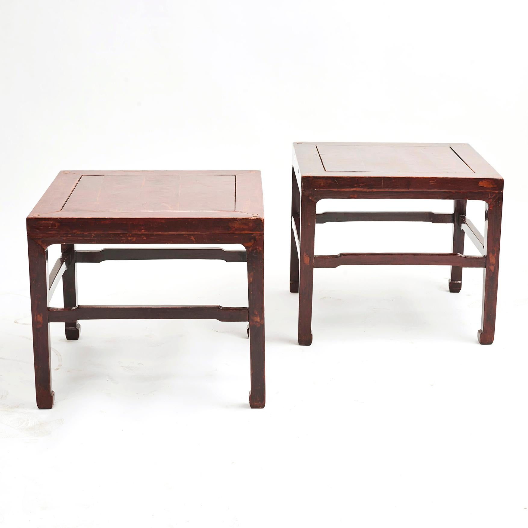 Pair of Chinese Ming style square side tables.
Original red lacquered elmwood with natural age-related patina.
Clean and simple lines, with minimal decoration.

Jiangsu Province, 1860-1880.
    