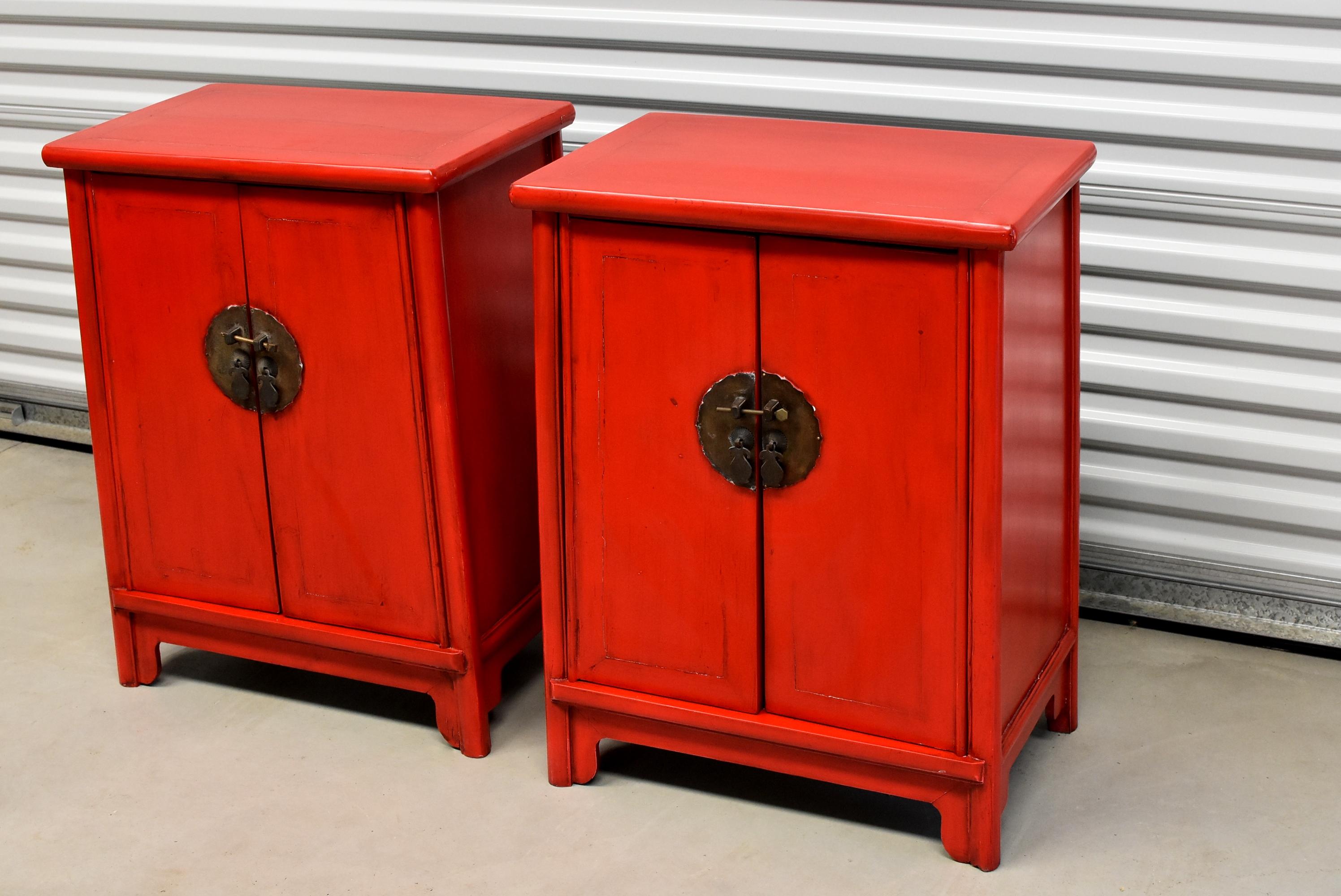 Price is for the PAIR. A pair of beautiful Chinese red lacquered cabinets. These cabinets were made in the Ming style, a timeless design that works well in almost any interiors. Saturated glorious, hand applied, red lacquer. Solid brass, custom