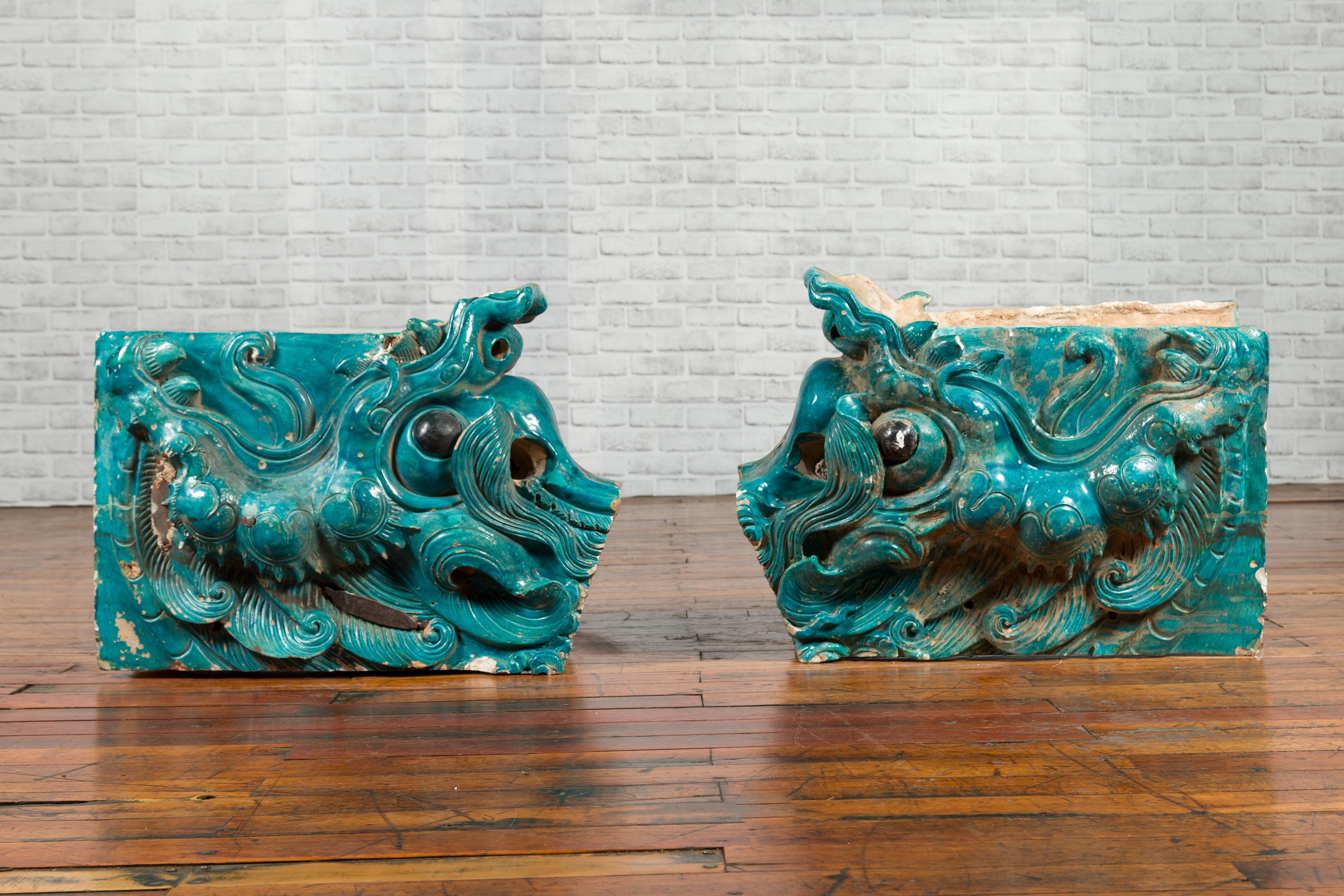 A pair of 15th or 16th century Ming Dynasty turquoise glazed ceramic dragons. This pair of Chinese architectural temple dragons made during the 15th or 16th century in a turquoise glazed ceramic is a great testimony of the Ming Dynasty ceramic. The