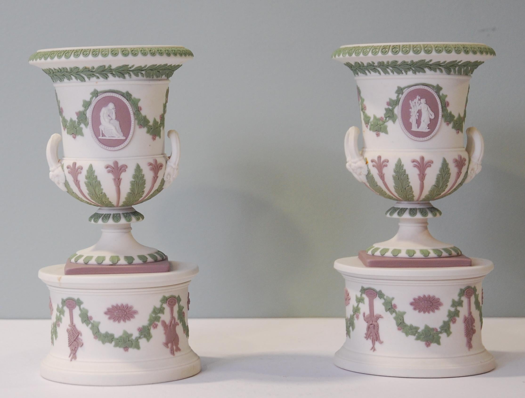 A rare pair of campana vases in white jasper with sage and lilac decoration, with pedestals. These were made as potpourri vases, and would have had lids orginally.
.