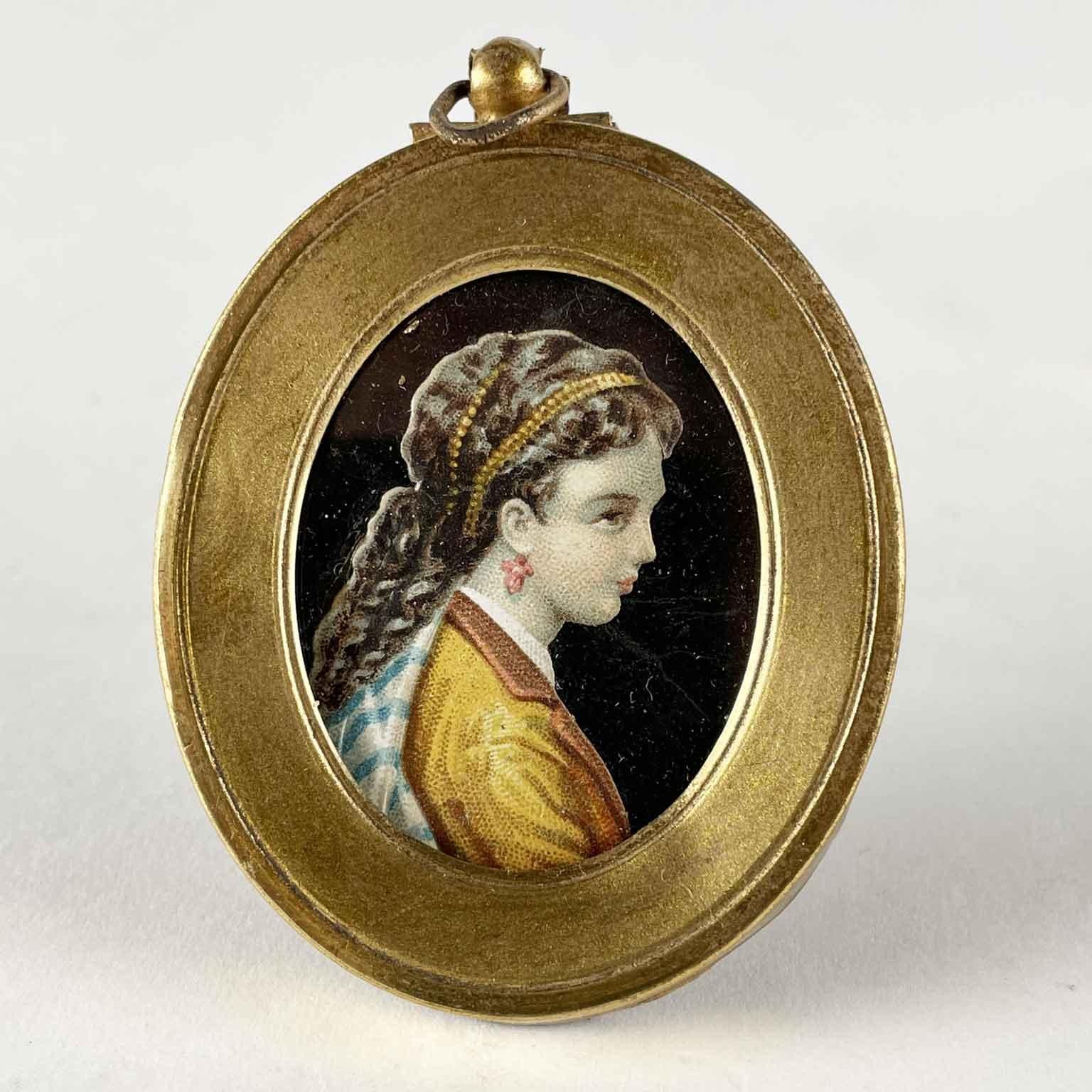 A lovely pair of portrait miniatures of two ladies, by a French skillful artist who painted in fine pointille technique on paper this pair of portraits in the 1870s circa.

Set in two beautiful brass frames, can be hanged or placed on a table.
Good