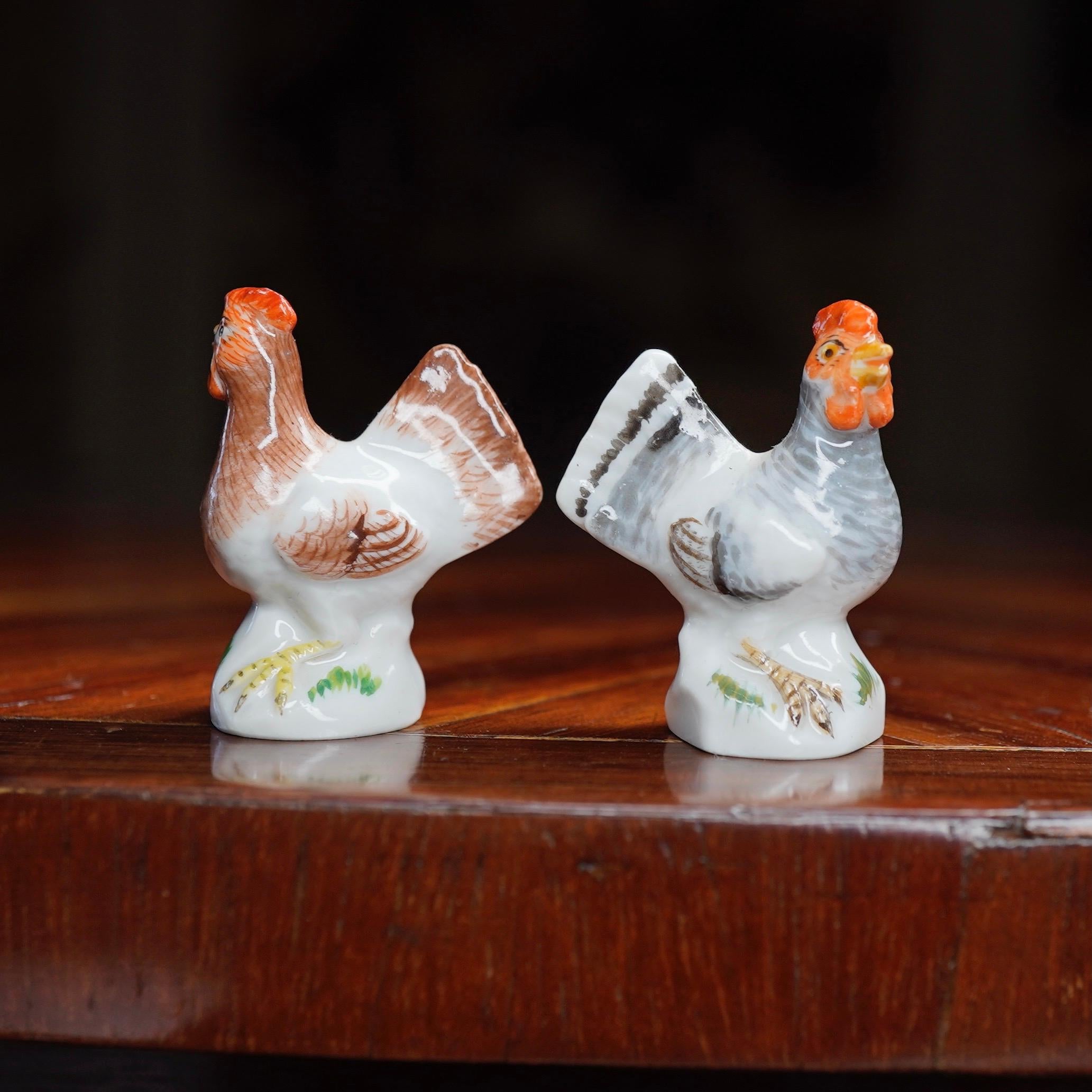 Pair of miniature Meissen chickens, naturalistically coloured.
Crossed swords mark, also incised numbers, 
19th century.