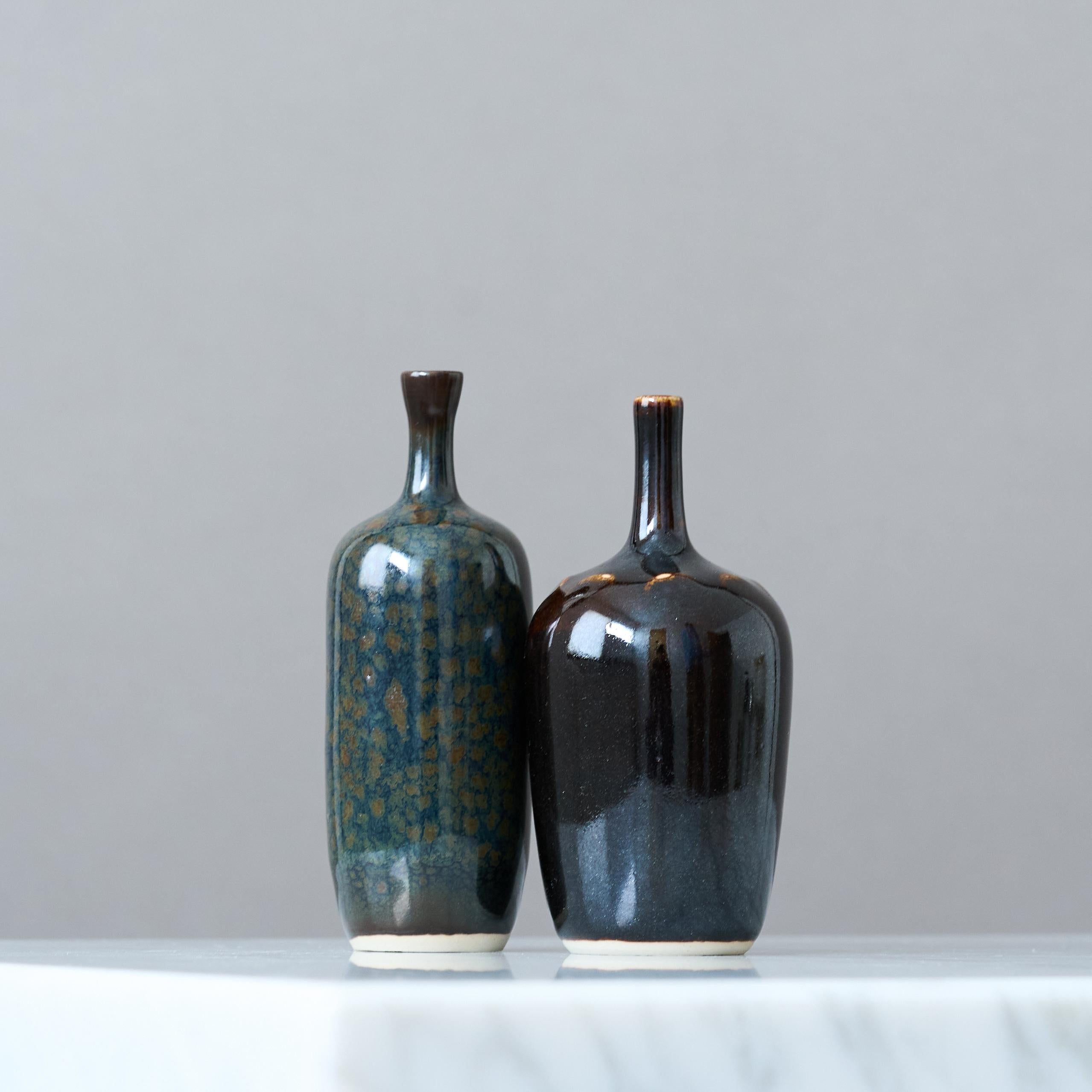 A pair of beautiful stoneware miniature vases with amazing glaze.
Made by Rolf Palm, in the artist's studio, Mölle, Sweden, 1970s.

Excellent condition. Incised ’Palm / Mölle’.

Rolf Palm (1930–2018) was one of Sweden’s leading ceramic artists in