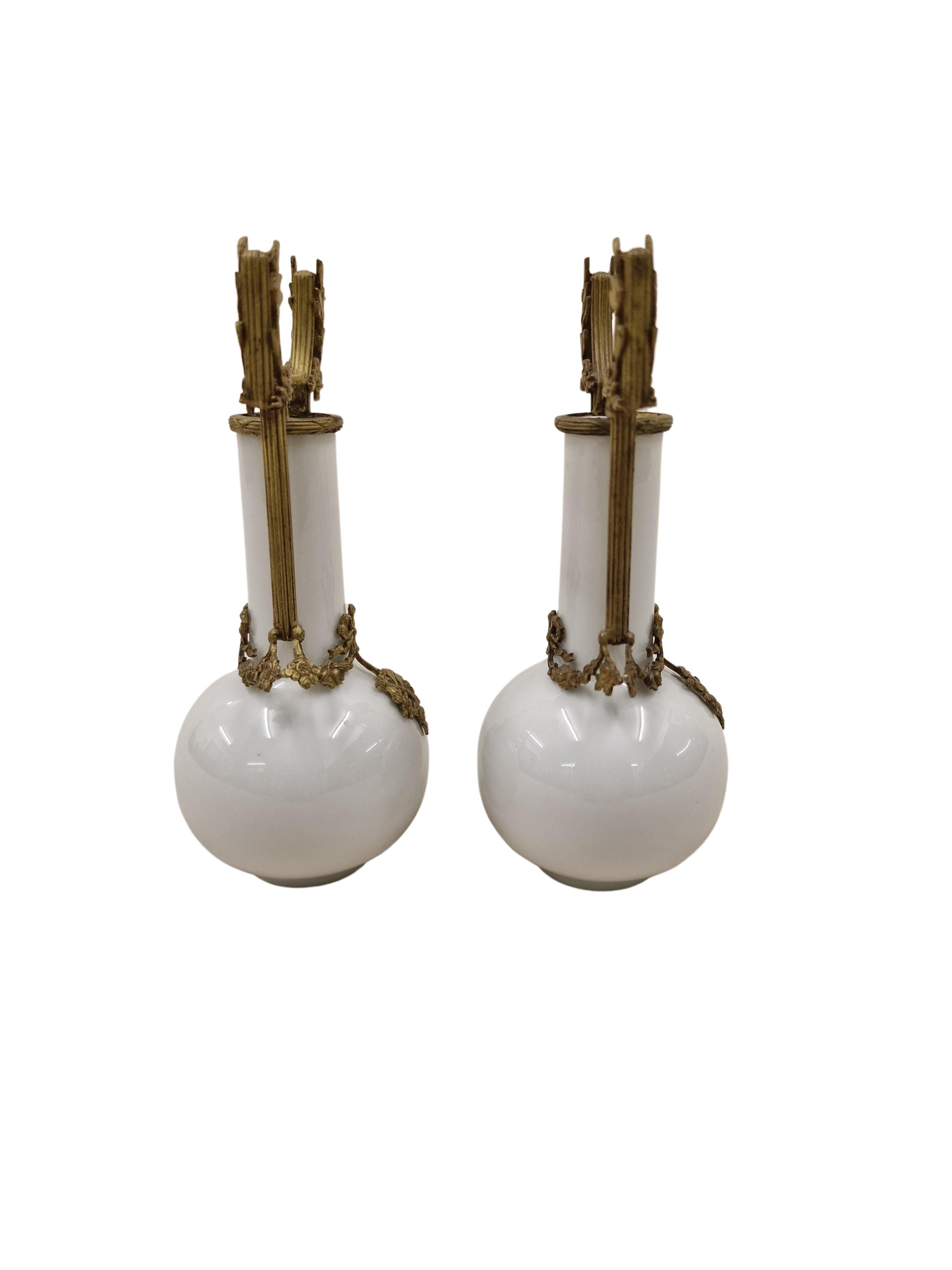 Outstanding pair of porcelain vases, so-called miniature vases, made around 1880-1900, late napoleon III, country of origin: France. These nice objects are out of white porcelain with particularly high quality bronze mounting. Every centimeter is