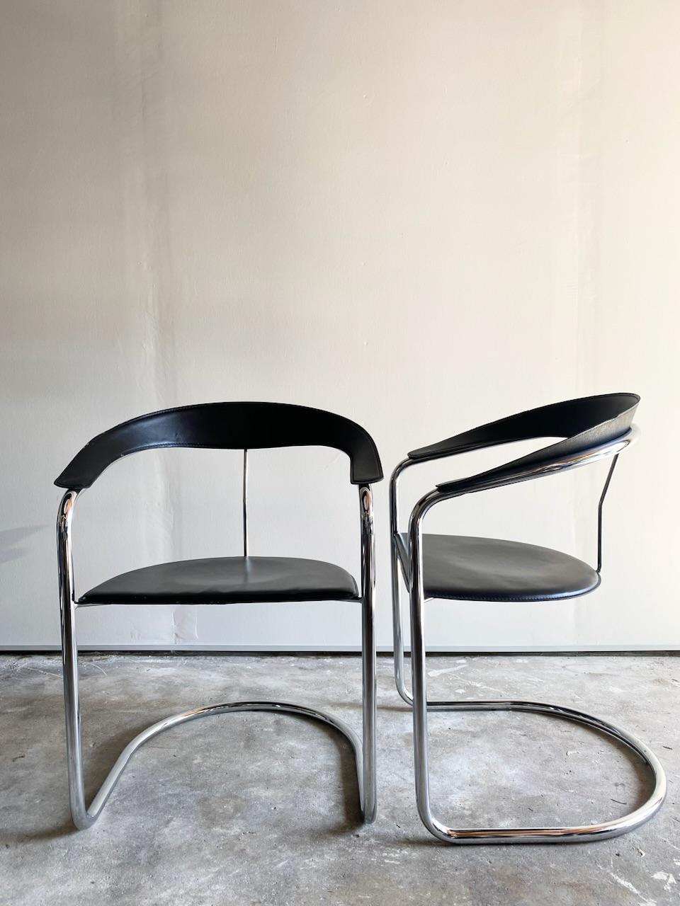 Minimalist, elegant Canasta chair, manufactured by the Italian Arrben manufacturer during the 1970s. Chrome cantilever, exquisite leather that wraps the frame, hand stitched, no detail is unnecessary. A confident and refined piece of minimalism.