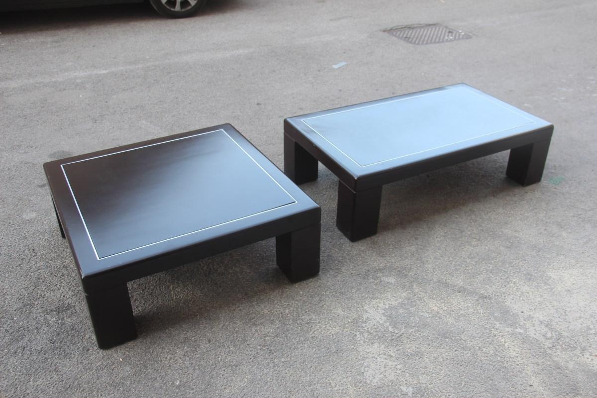 Pair of Minimalist low tables in brown and aluminum Lacquer Italian design, 1970.

Measures: Square cm.90 x 90 height cm.33
Rectangular cm.120 x 70 height cm.33.