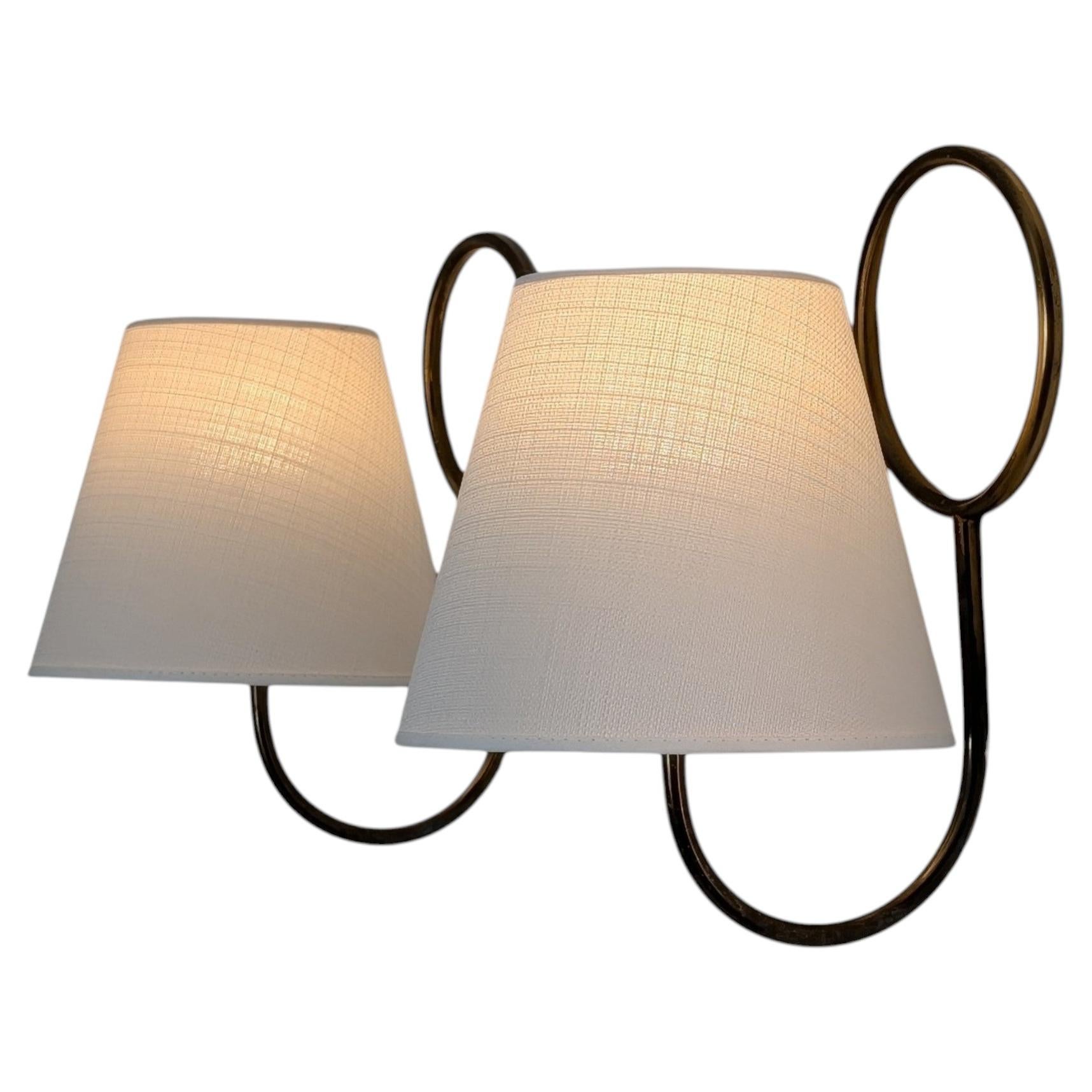 What is the difference between a sconce and a wall lamp?