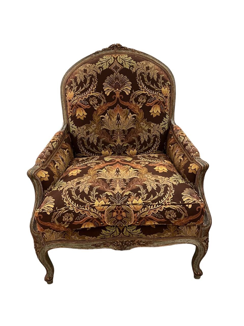 Elevate your living space with a timeless touch of elegance courtesy of this exquisite pair of Minton-Spidell Louis XV style Bergere Chairs. Crafted with meticulous attention to detail, each chair features sumptuous damask fabric upholstery that