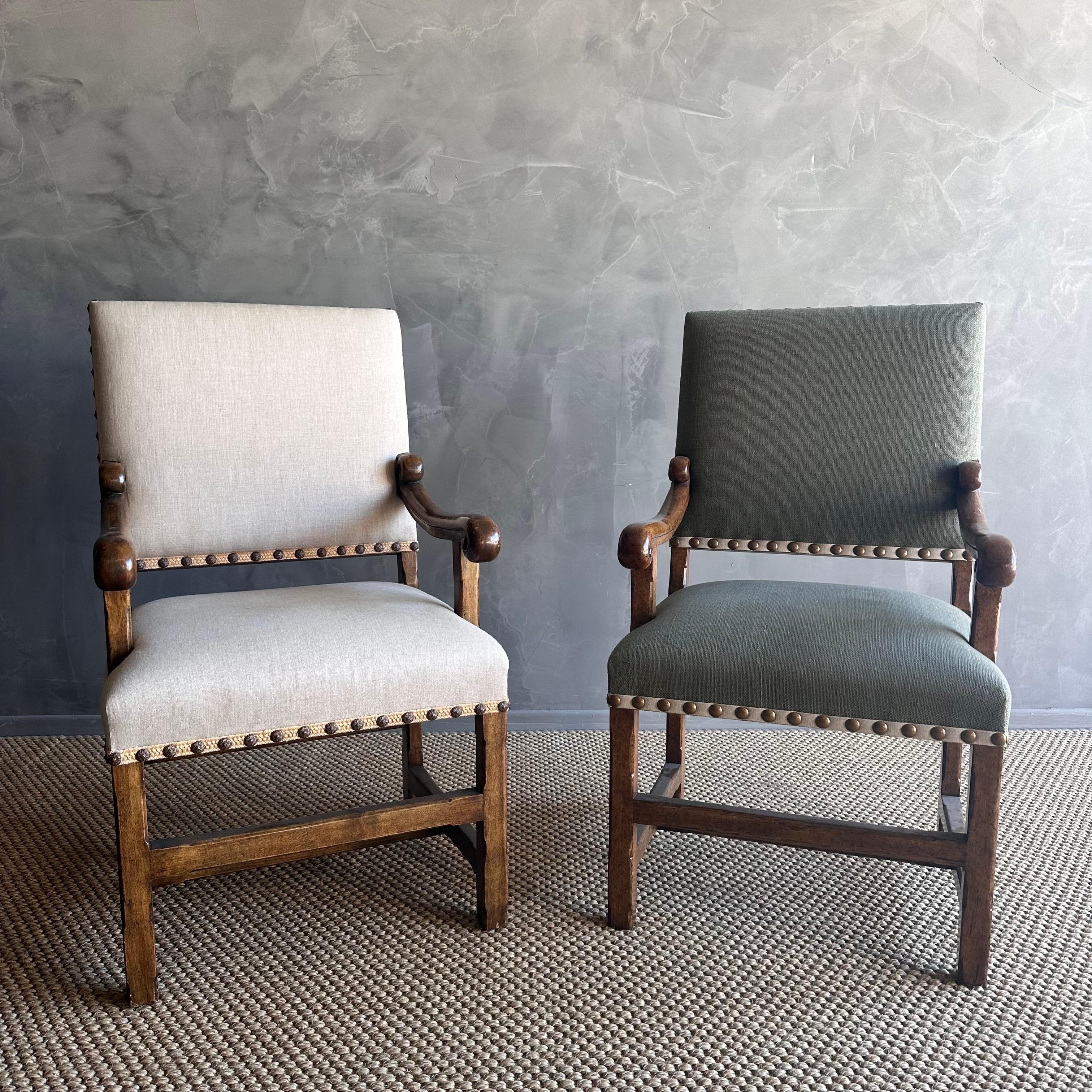 Enhance your French country decor with this exquisite pair of Minton Spidell French arm chairs. Crafted from high-quality fruitwood, these antique-style chairs are ready for upholstery, allowing you to customize them to suit your taste and interior