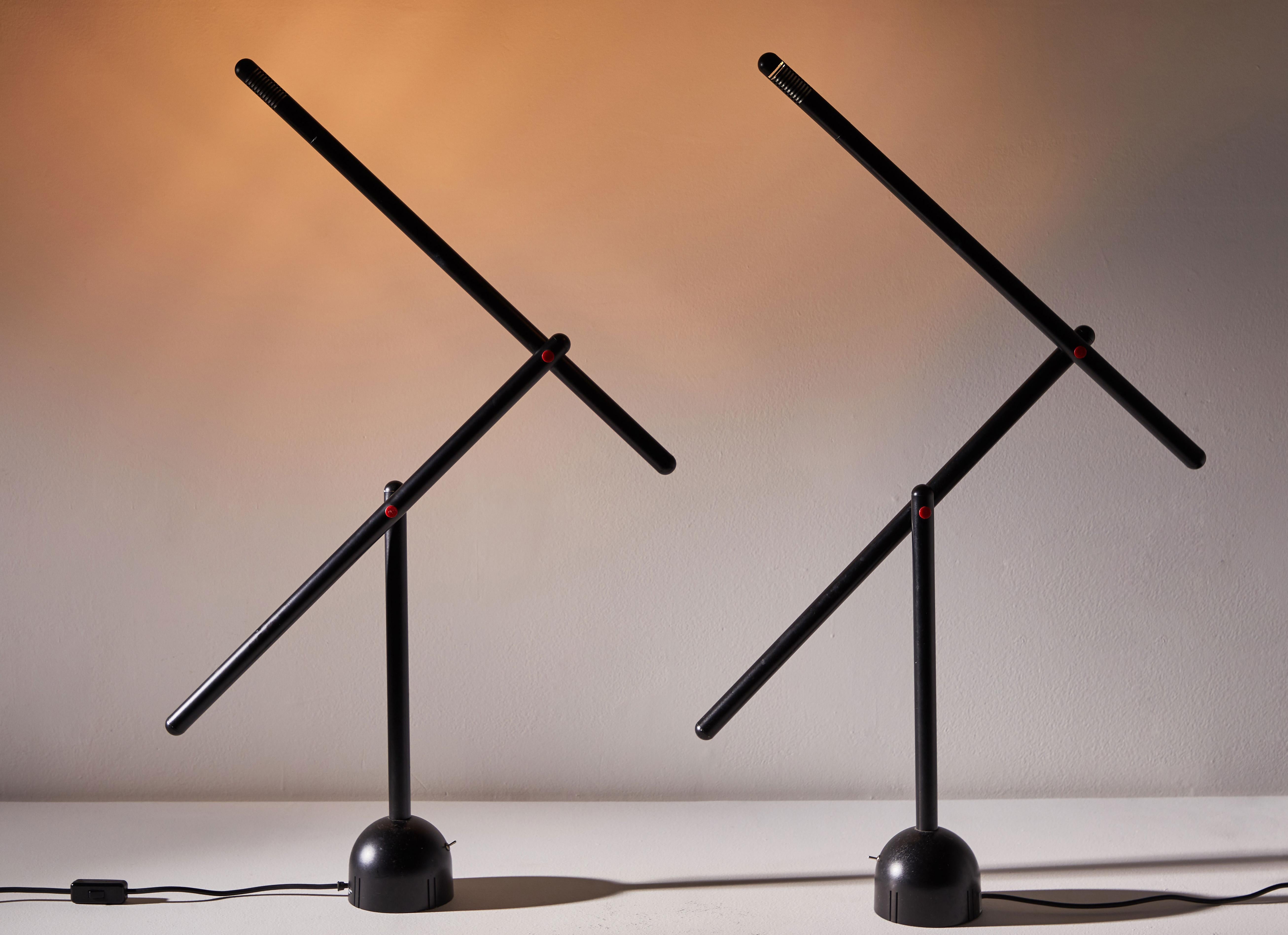 Two Mira table lamps by Mario Arnaboldi for Programmaluce, Italy, 1984. Enameled metal and aluminum construction with pivoting head. Original cord. Each light takes one G9 halogen bulb. This lamp was only produced for a year. Original manufacturers