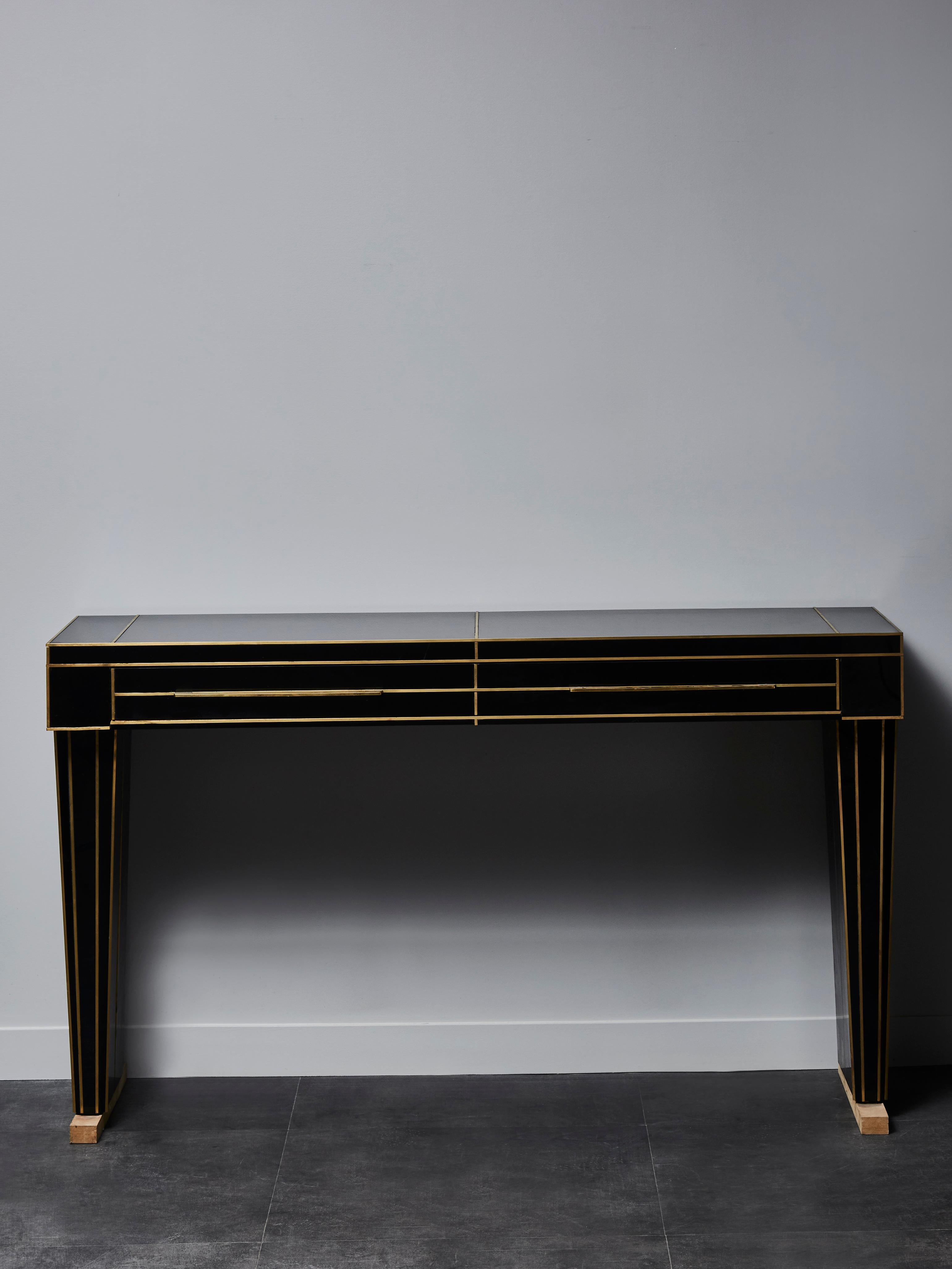 Stunning console in black tainted mirror with brass inlays. 1 drawer.
Creation by Studio Glustin.

Note: wood bases are meant to be removed. It is only used as a protection.