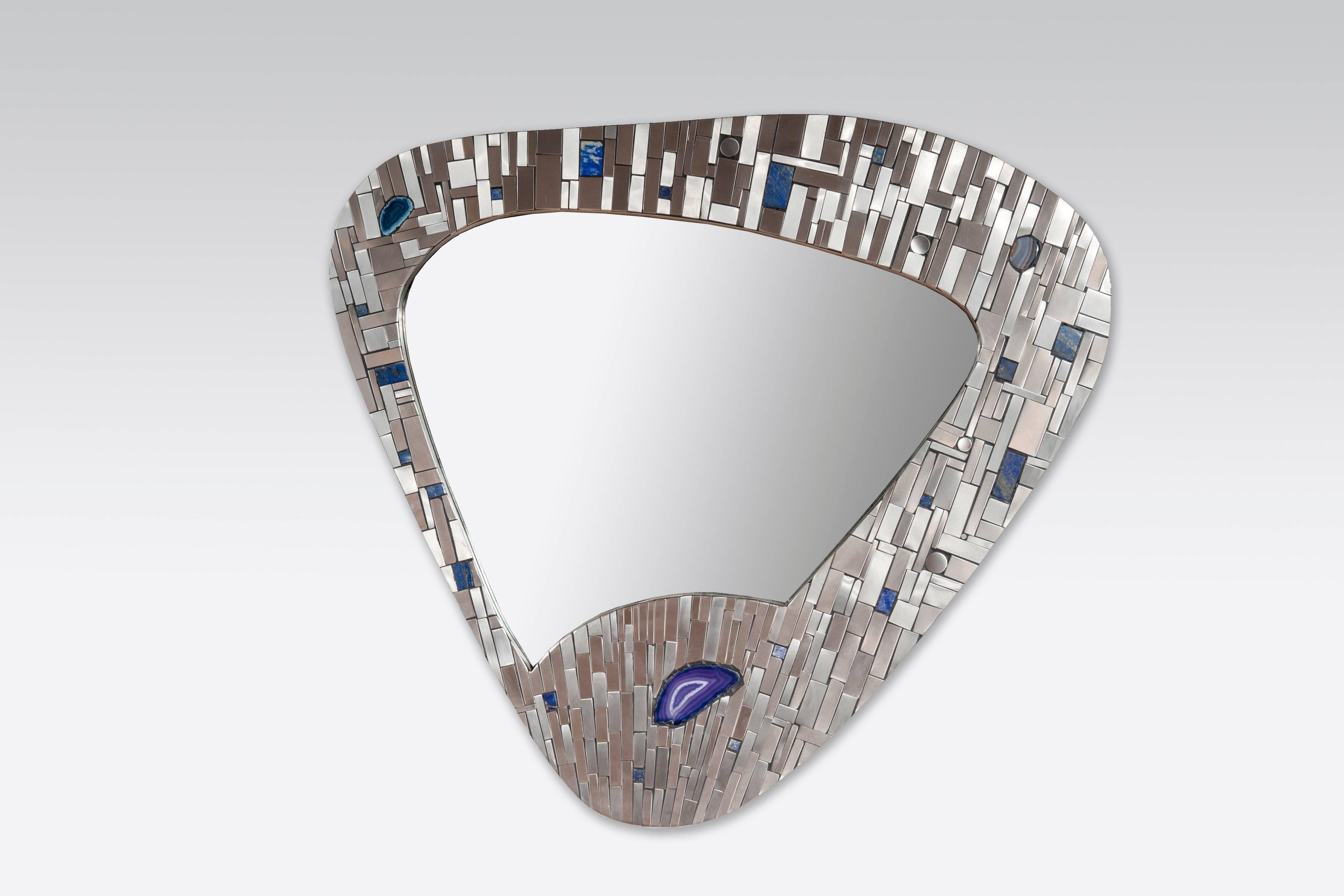 Created to measure by Stan Usel, this original pair of mirrors left and right in stainless steel are inserted with original lapis lazuli and agate stones. When put together within your interior decoration these mirrors reflect a sense and deepness