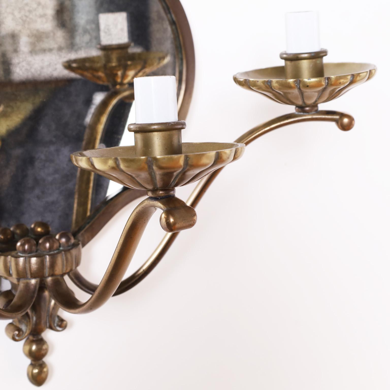Hand-Crafted Pair of Mirrored Wall Sconces For Sale