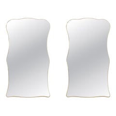 Pair of mirrors, Gio Ponti style. Brass frame. 1980s.