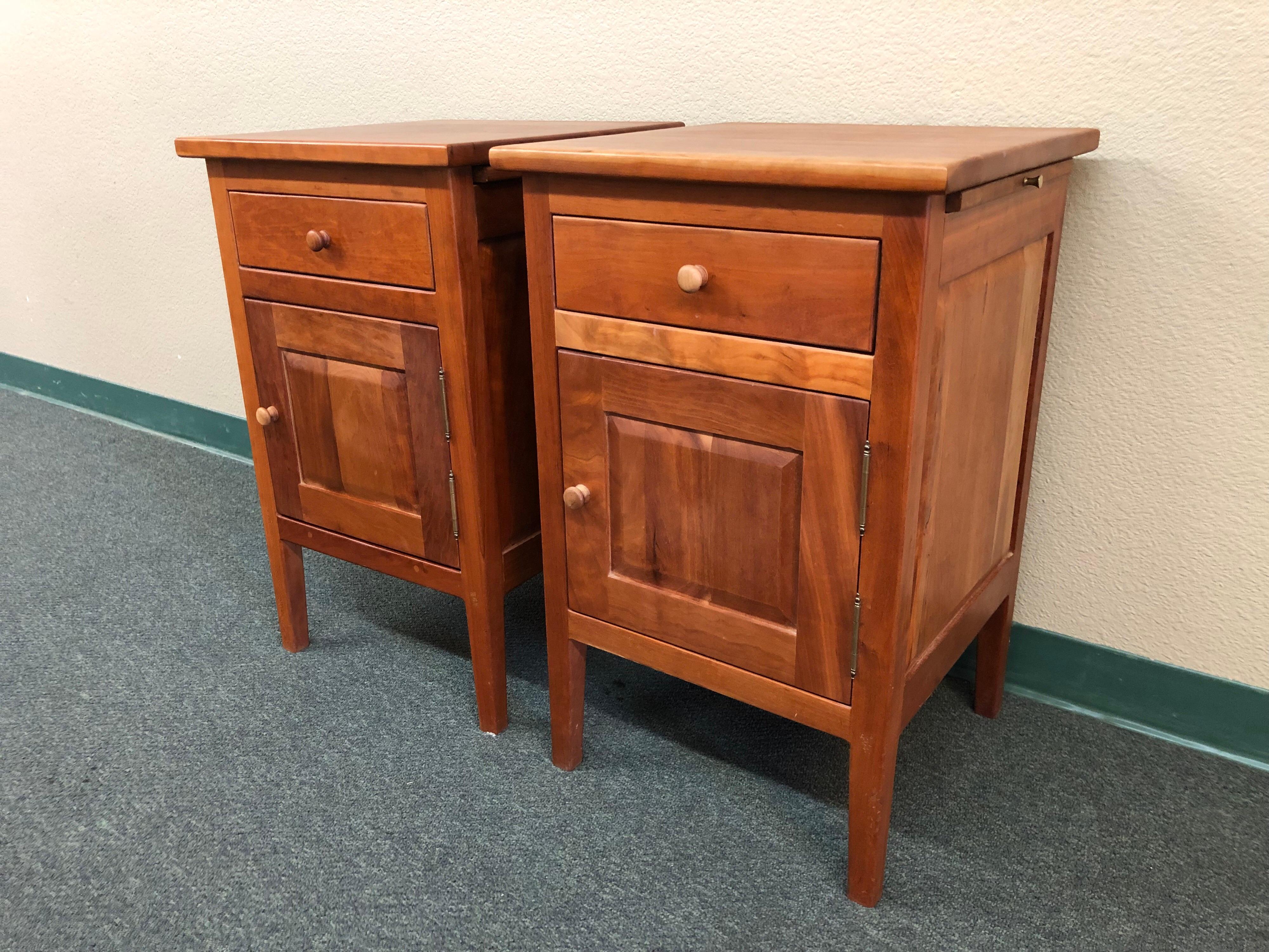 A pair of Amish made side tables by Borkholder. The simple, yet elegant silhouettes are clean and modern in design. A blend of Mission and Shaker styles, these are timeless pieces to be used and enjoyed for generations. Handcrafted details include