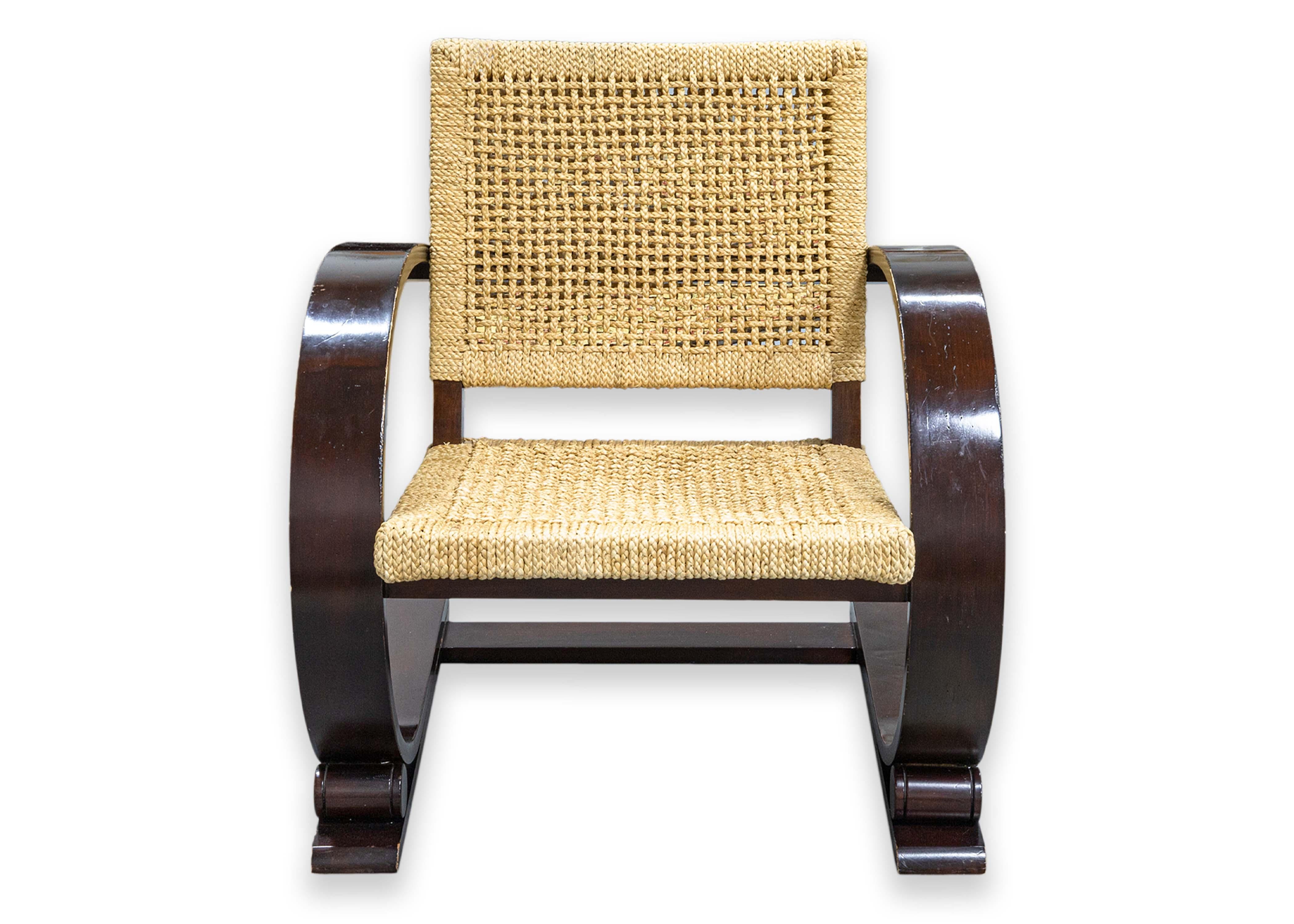 A pair of Mitchell Gold & Bob Williams cane armchairs. This is a beautiful set of accent lounge chairs, inspired by the original designs of Adrien Audoux and Drida Minet for Vibo Vesoul. These canteliever style chairs feature a full wood