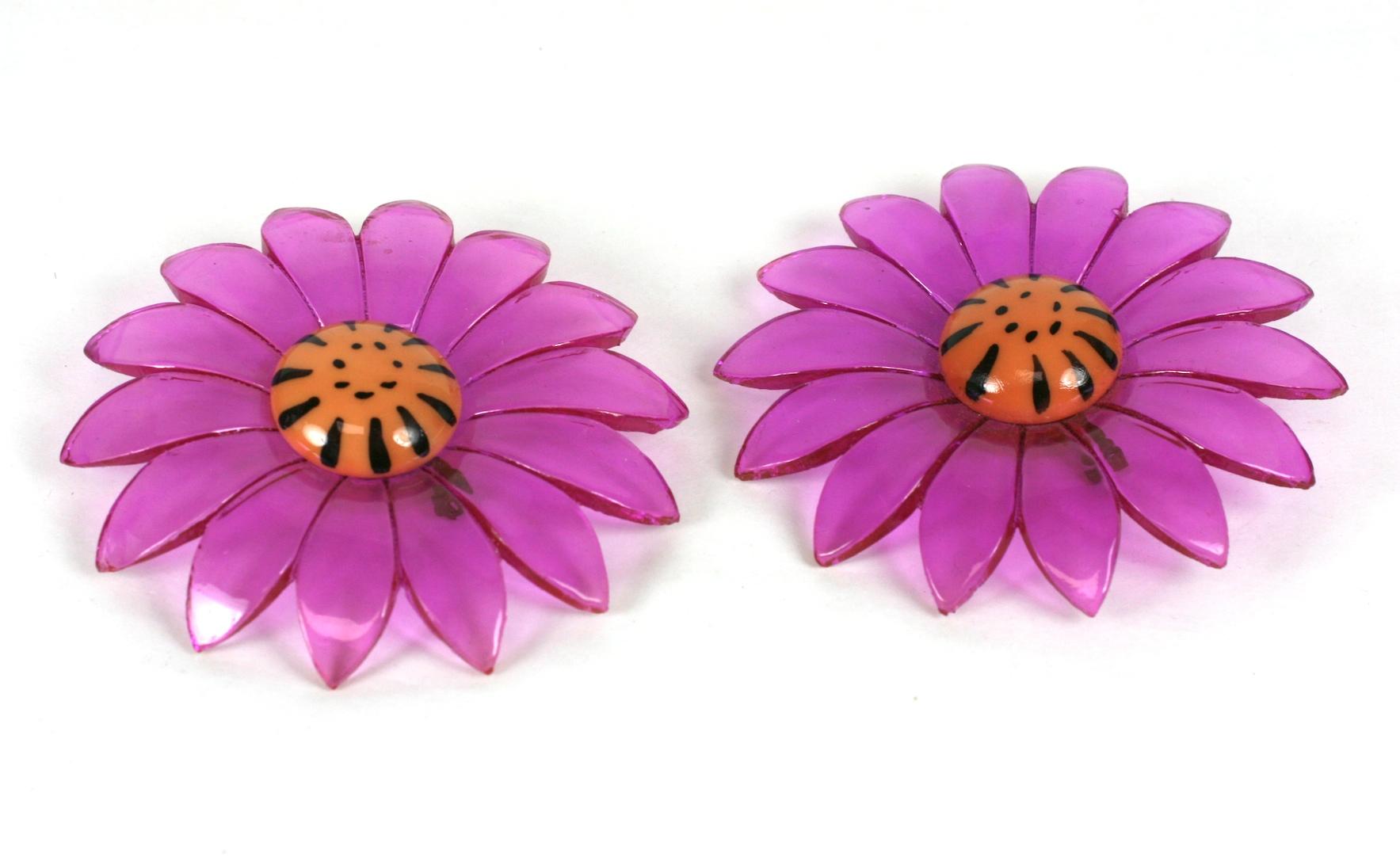 Pair of oversized Mod Lucite Daisy brooches of fuschia pink cut and carved lucite. Flower button centers of orange plastic with hand painted details.
Excellent Condition, 1960's USA.
