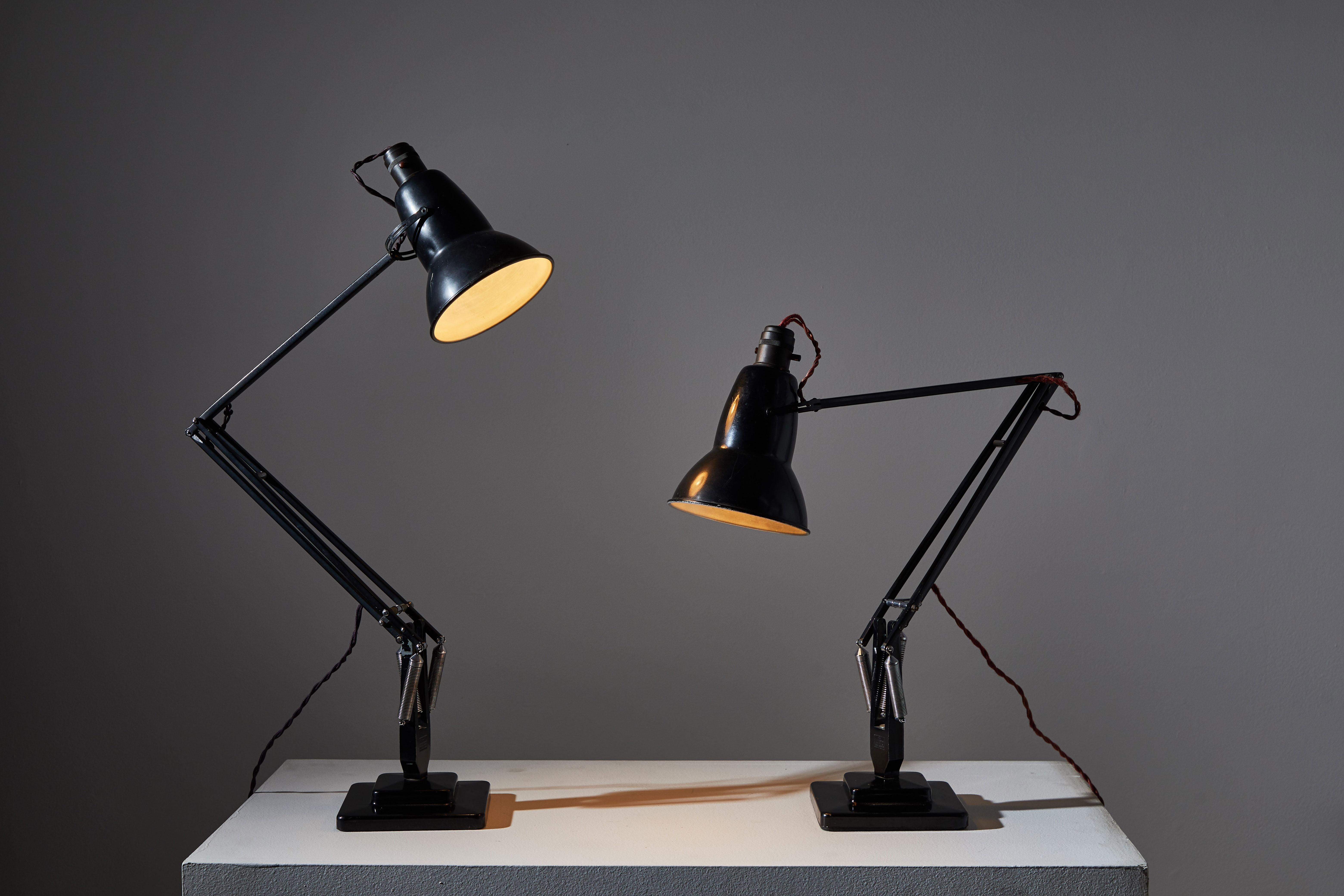 Two model 1227 table lamps by George Carwardine for Anglepoise. Designed and manufactured in the United Kingdom early 1920s. Enameled metal and iron. Original cord and bakelite sockets. Maintains original manufacturer's patent stamp. Shade