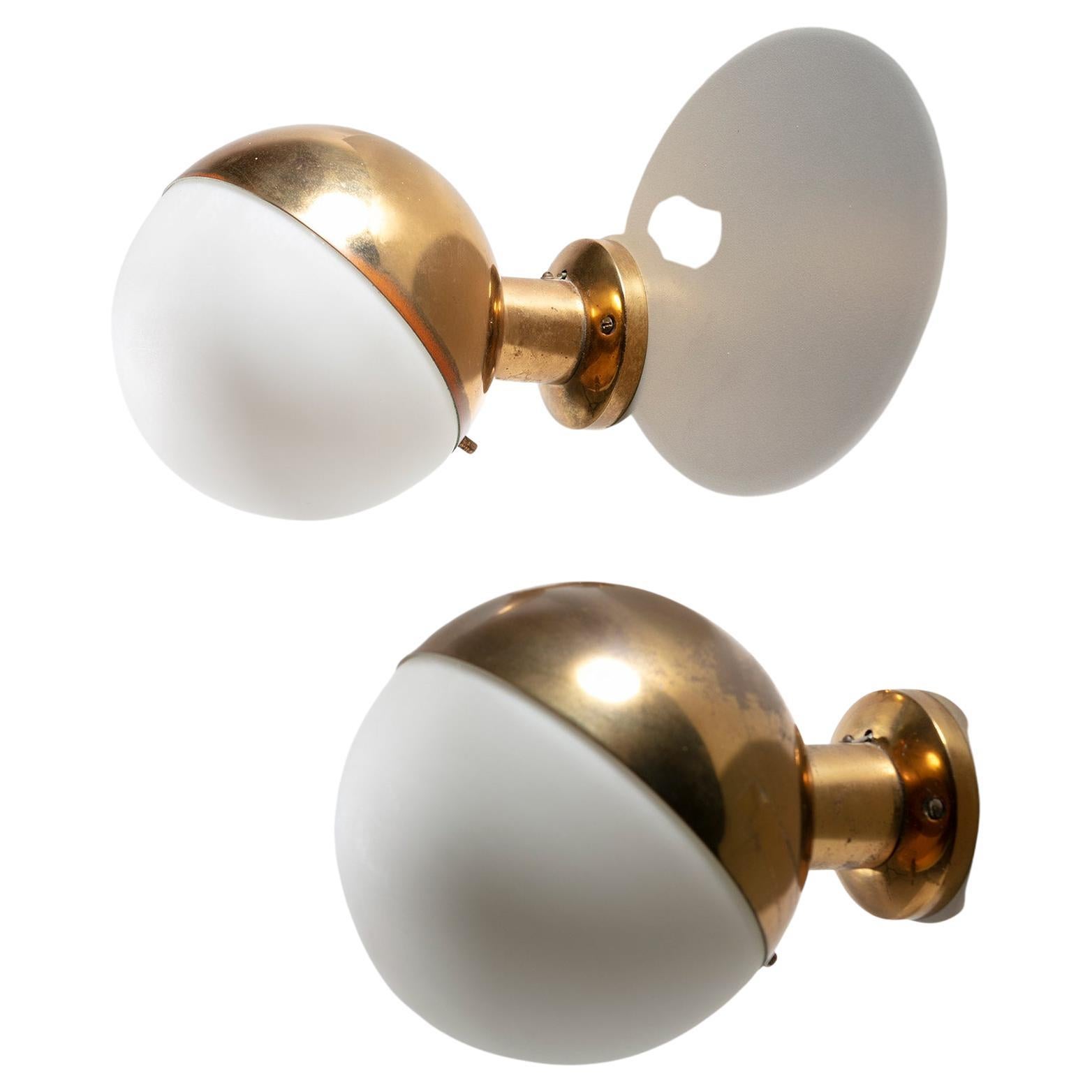 Pair of Stilnovo sconces model 2045 with opaline glass shade and and brass frame.