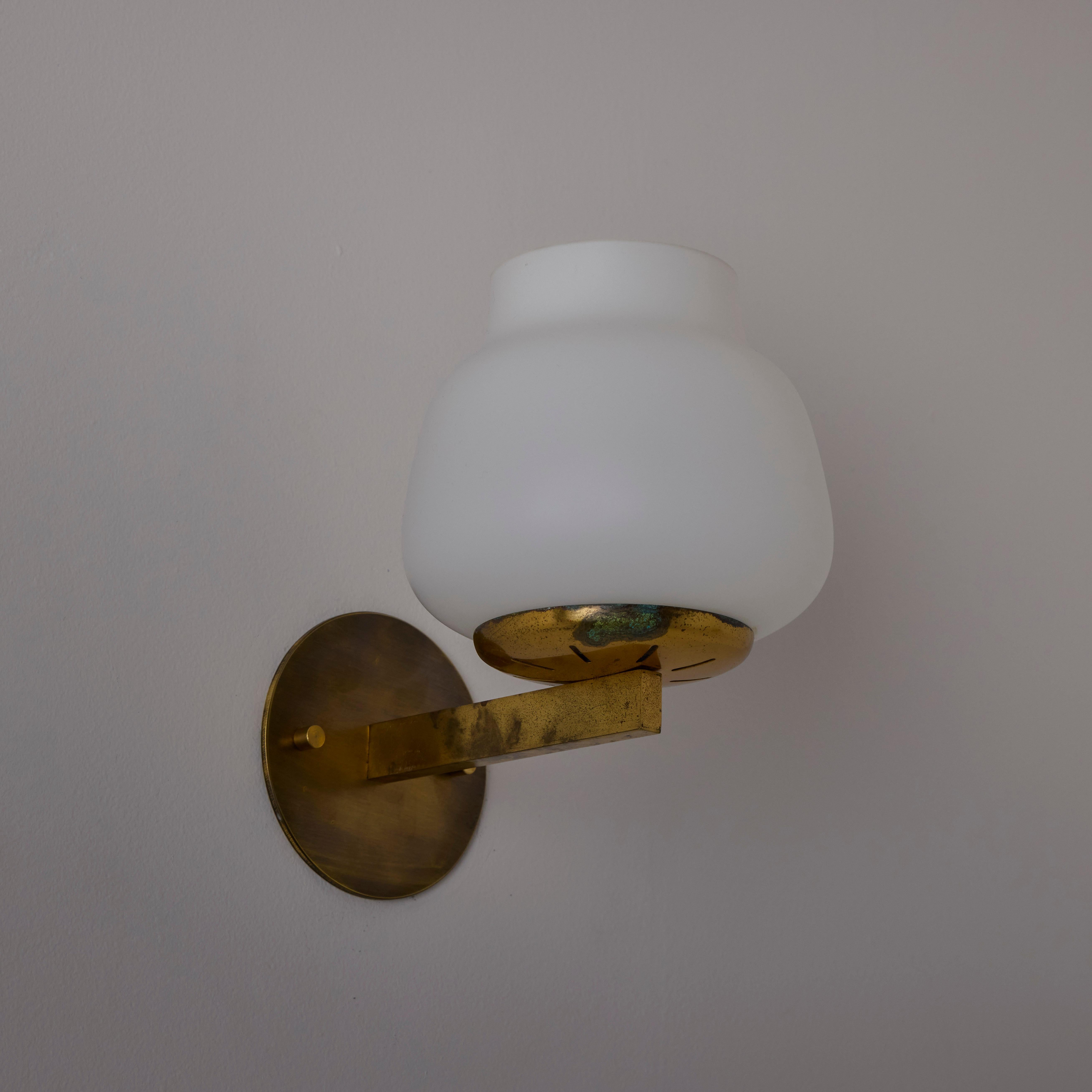 Pair of model 2078 Sconces by Pierre Disderot Patinado en venta