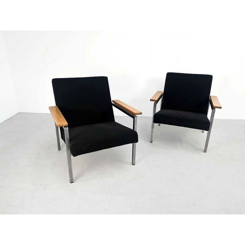 Pair of model 30 Gijs Van Der Sluis lounge chairs.

Rare set of model 30 Gijs Van Der sluis chairs. These chairs were manufactured by ‘t Spectrum in the 1960's. They have a new black upholstery, the chromed metal frame and wooden armrests are in