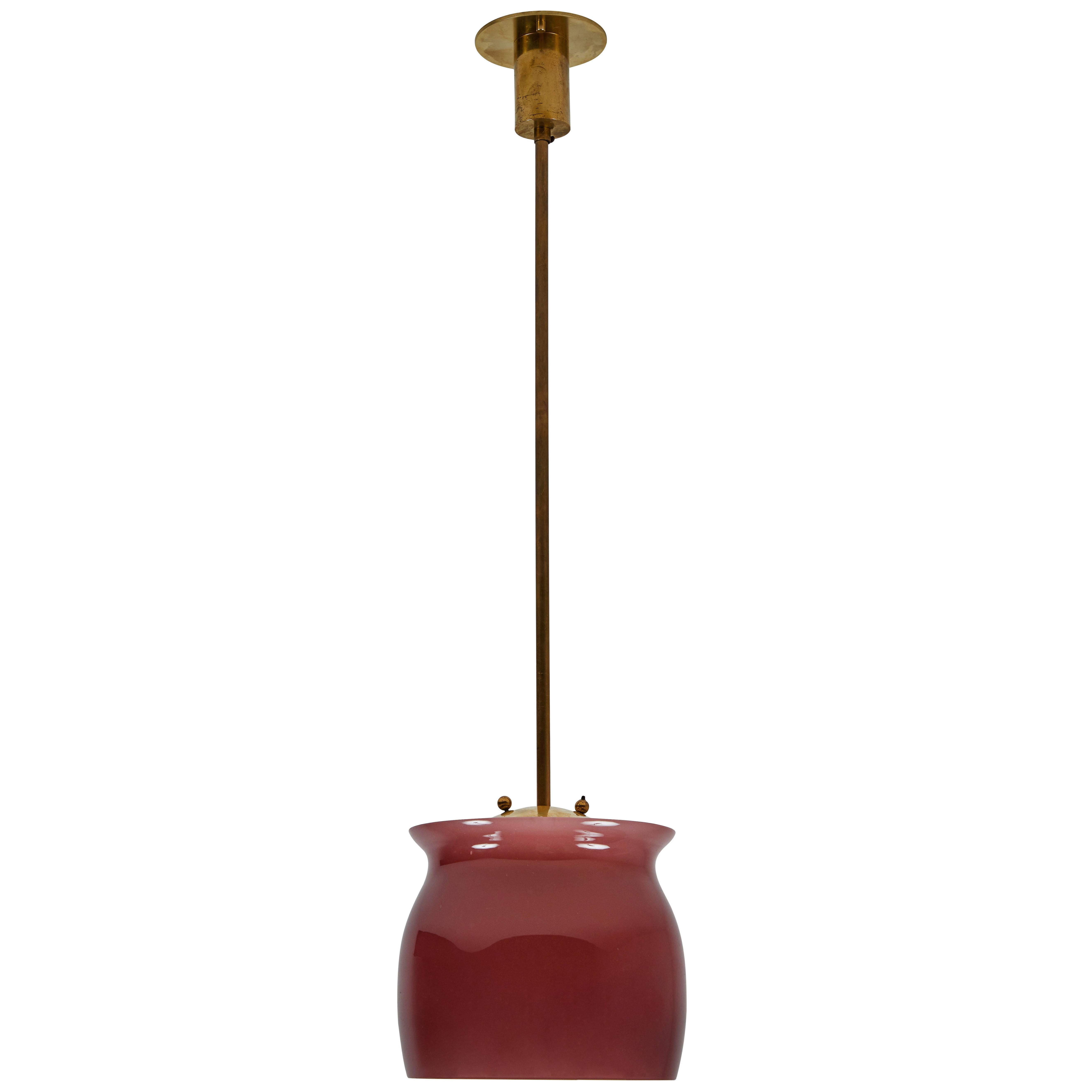 Pair of model 4023 pendants by Franco Albini for Venini. Designed and manufactured in Italy, 1955. Polished brass, colored Murano glass diffuser. Outer glass shade rests on the inner diffuser, allowing for various positions. Rewired for US junction