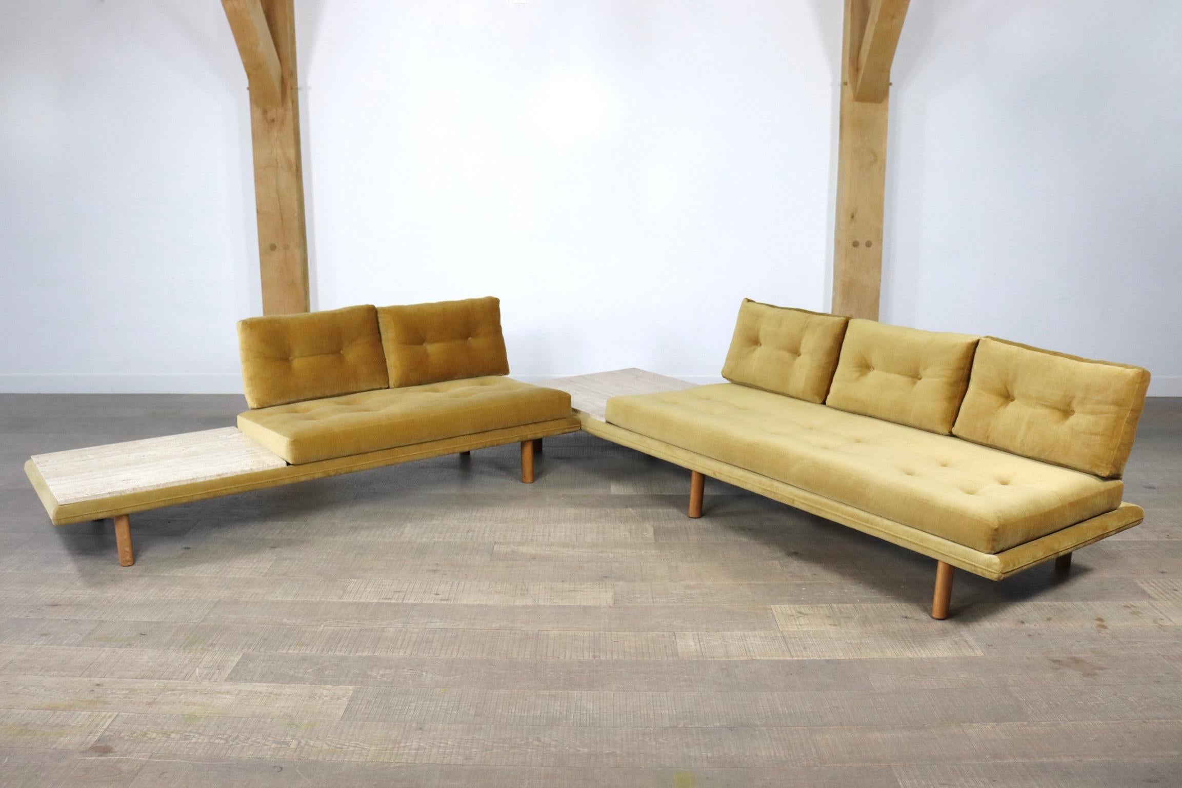 Incredible sofa / daybed model 6603 set by Franz Köttgen for Kill International, 1960s.
The set consists of a 3-seater sofa and a 2-seater sofa with original mustard velvet upholstery. Each sofa / daybed has a cream travertin coffeetable attached.