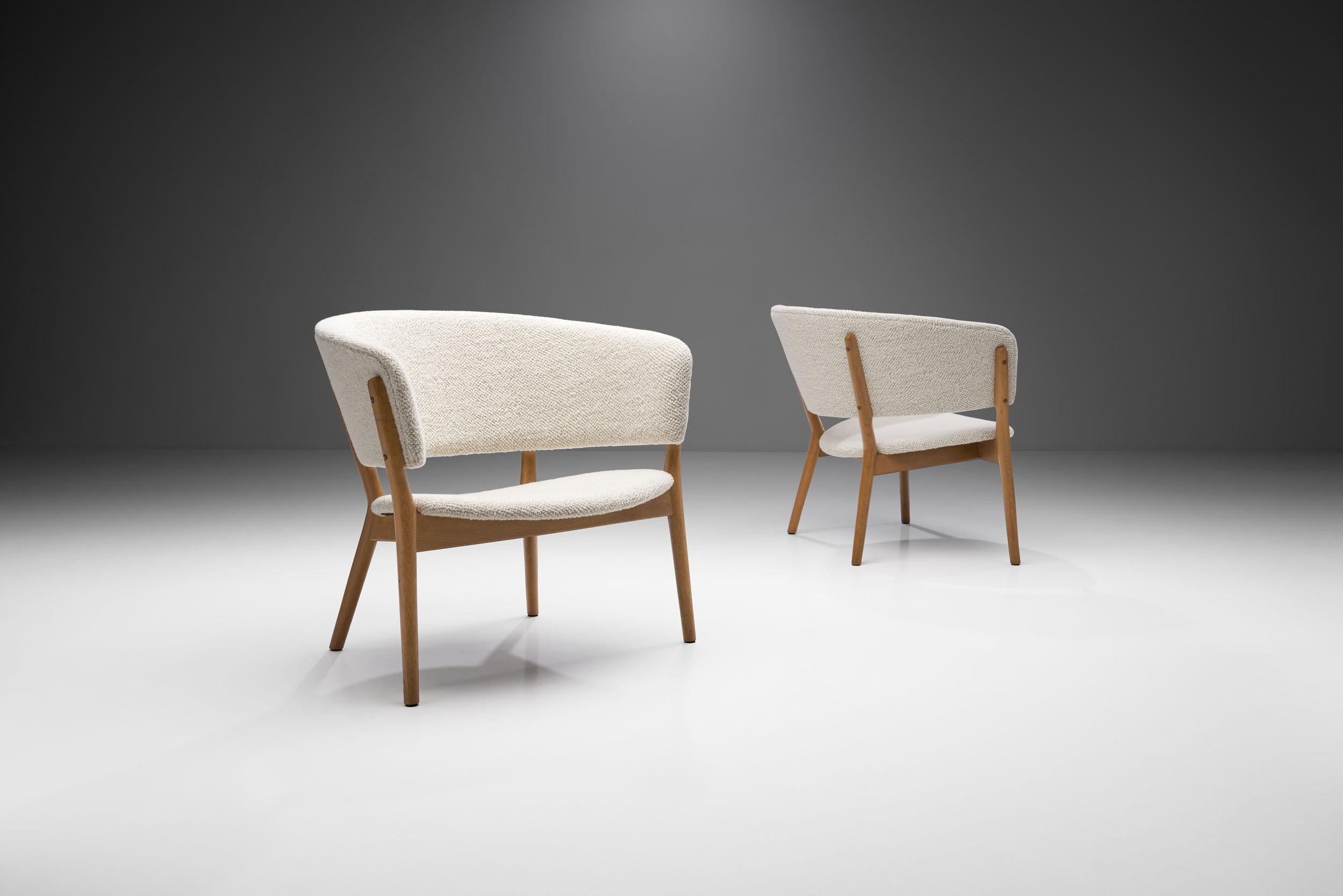 This pair of armchairs is what we consider a timeless Danish modern classic. The “ND83” was designed in 1952 by Nanna Ditzel for the exhibition 'Today’s Furniture, Home Equipment' in the Forum Hall Copenhagen in 1952.

Chairs are often considered