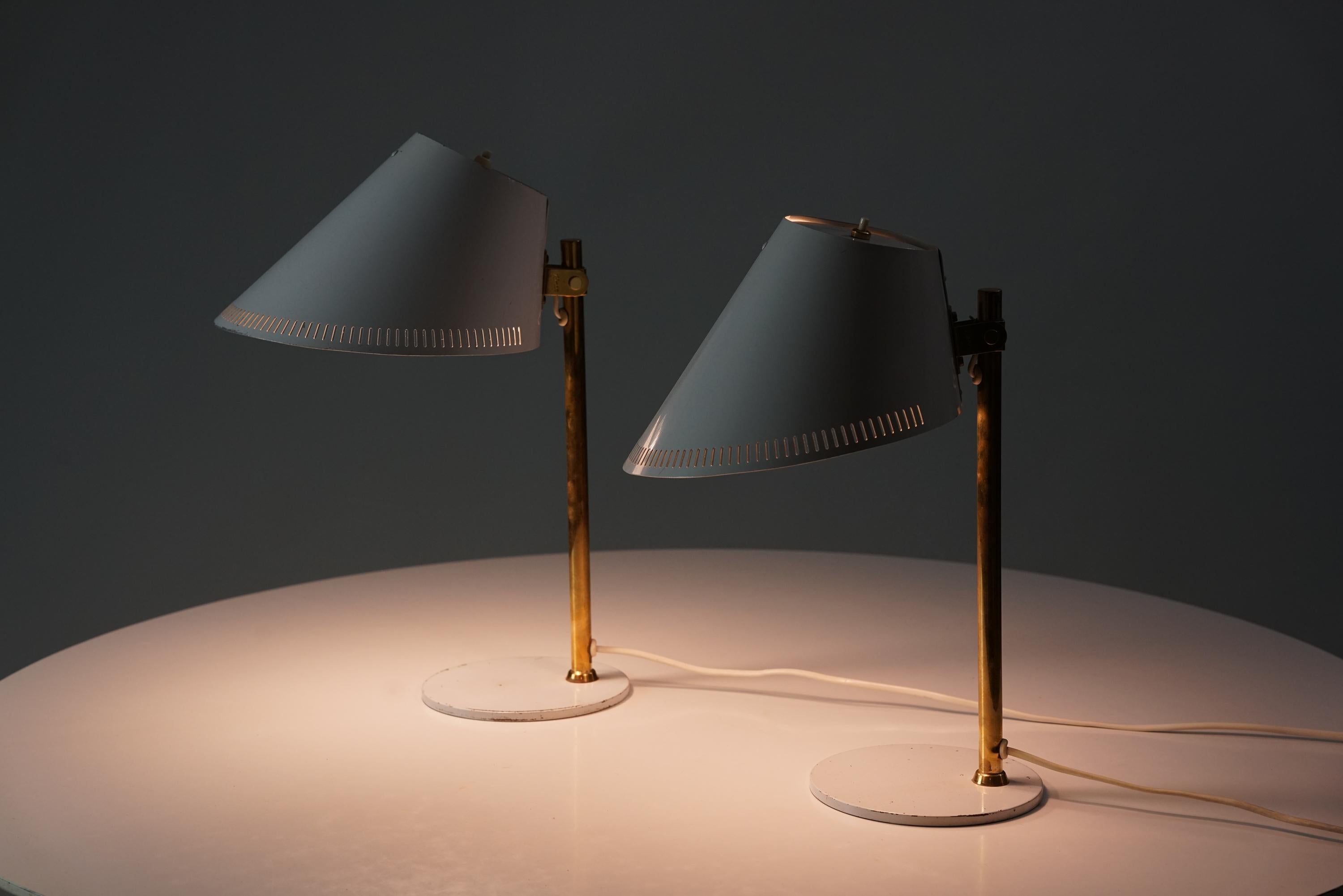 Pair of Model 9227 table lamps, design by Paavo Tynell, manufactured by Idman Oy, 1950s. Metal and brass. Good vintage condition, minor patina consistent with age and use. Iconic Paavo Tynell design. 

Paavo Tynell (1890-1973) is one of the most