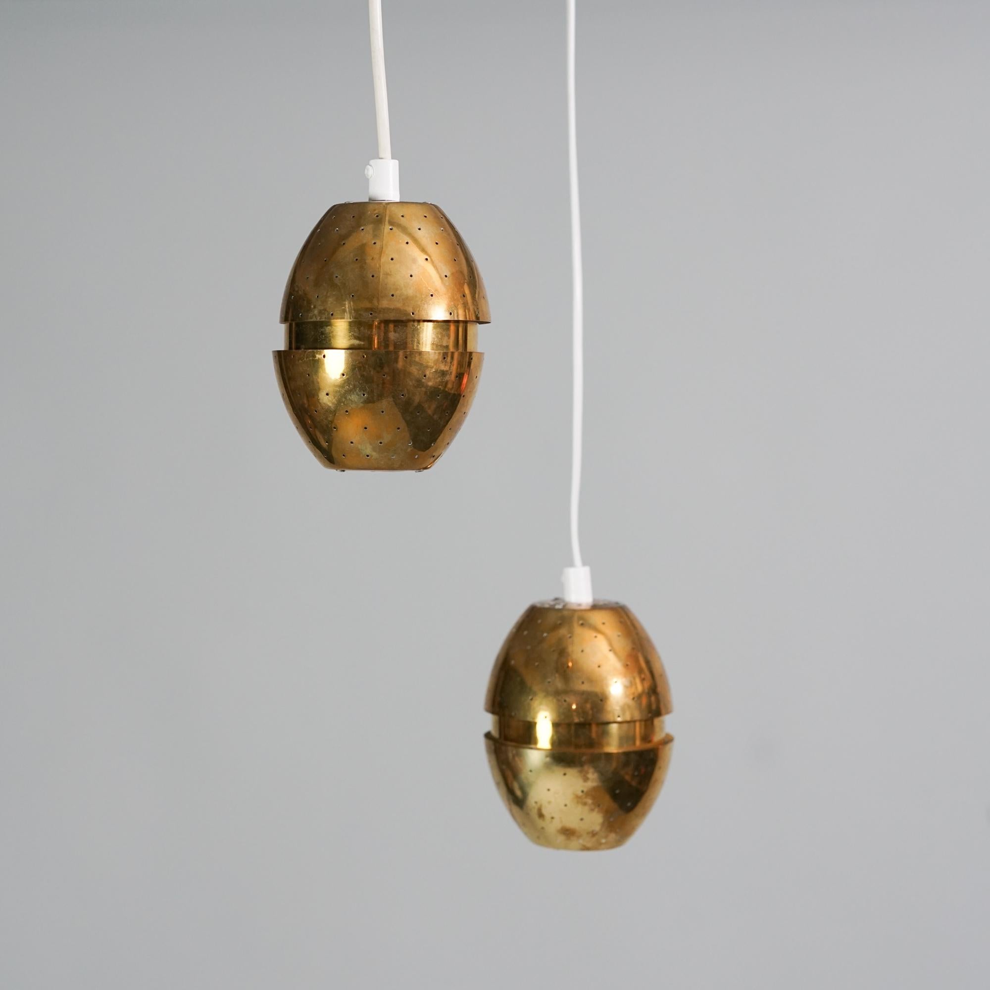 Pair of model Florina T790 pendants designed by Hans-Agne Jacobsson for AB Markaryd on the 1970s. Brass. Good vintage condition, minor patina and wear consistent with age and use. The pendants are sold as a set. 

Hans-Agne Jakobsson (1919-2009) was