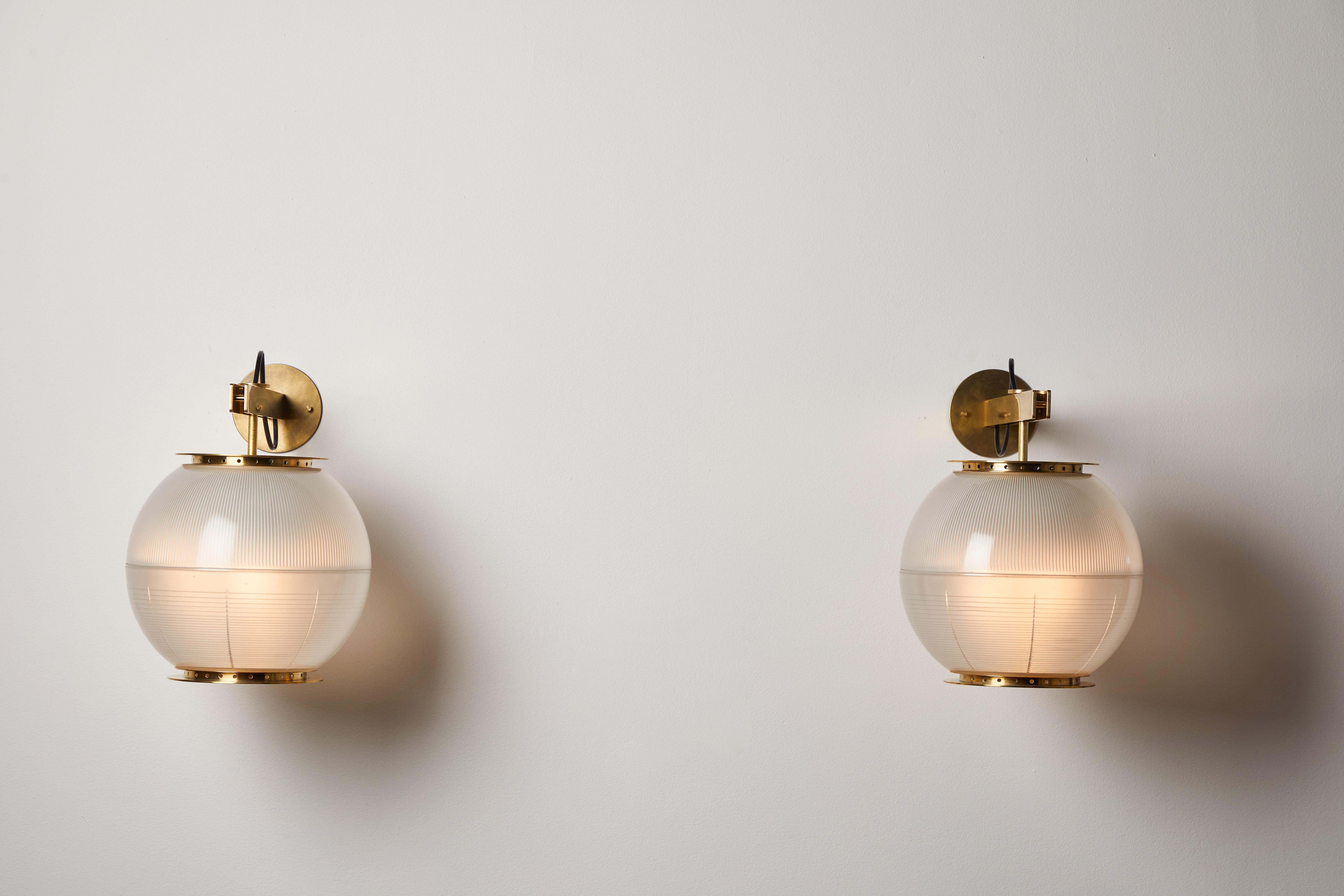 Pair of Model Lp7 Sconces by Ignazio Gardella for Azucena. Designed and manufactured in Italy, circa 1950s. Brass and holophane glass. Rewired for U.S. standards. Original backplates. Retains original manufacturer's mark. We recommend three E27 60w