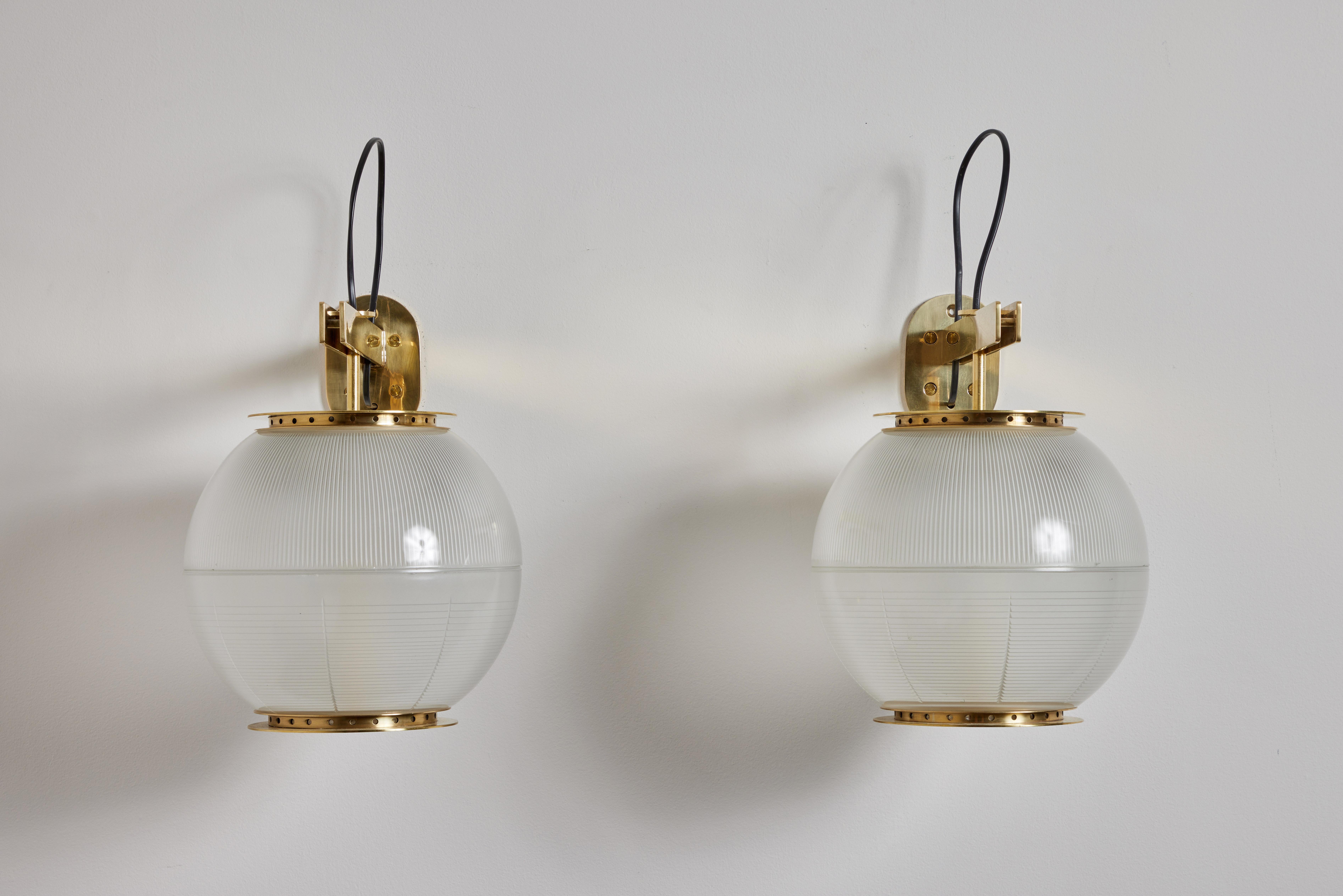 Pair of Model Lp7 sconces by Ignazio Gardella for Azucena. Designed and manufactured in Italy, circa 1950s. Brass and holophane glass. Rewired for U.S. standards. Original backplates. Retains original manufacturer's mark. We recommend three E27 60w