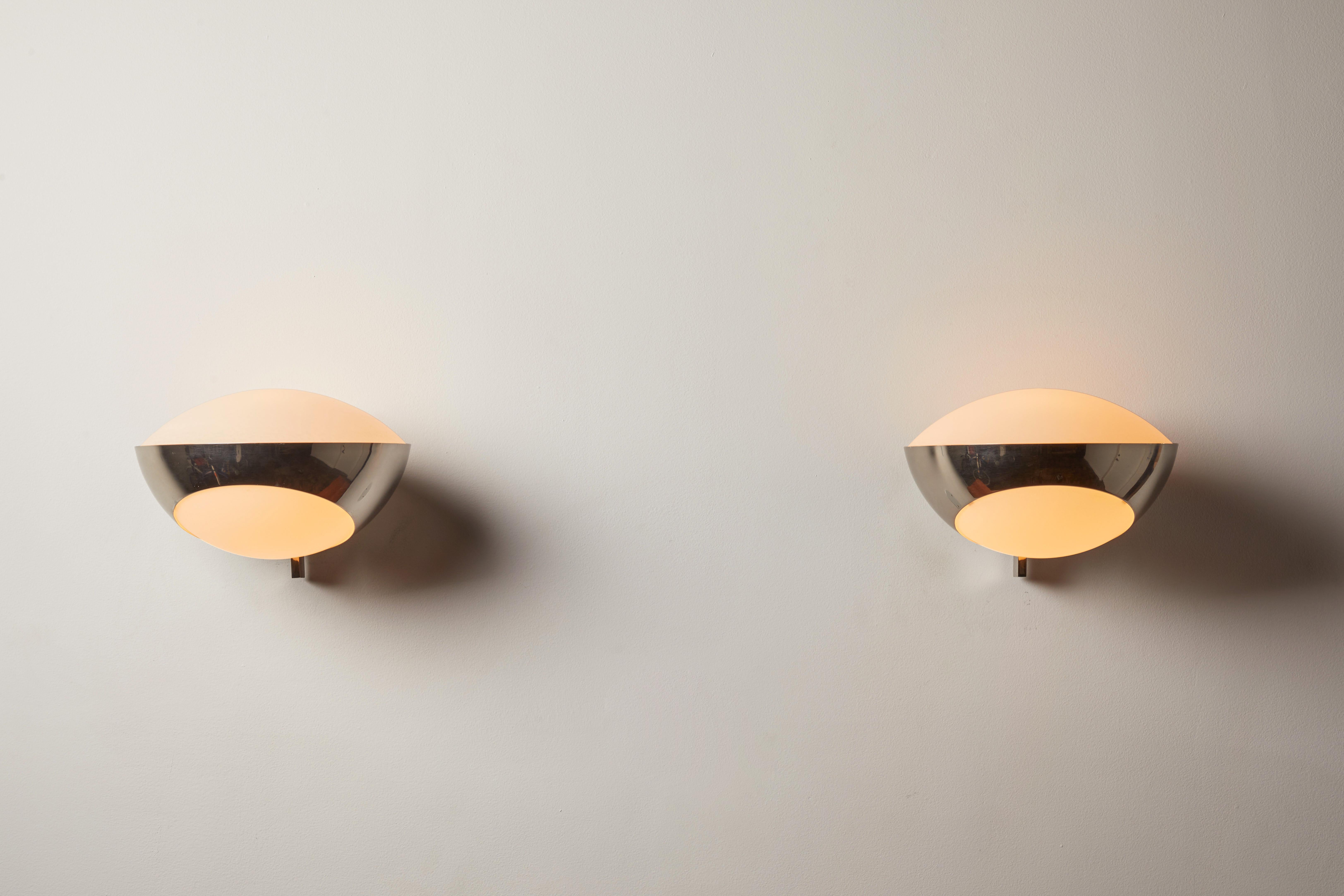 Pair of large Model No. 1963 Sconces by Max Ingrand for Fontanta Arte. Designed and manufactured in Italy, 1960. Brushed satin glass diffusers, chrome armature. Custom chrome backplates. Each light takes one E27 60w maximum bulb. Bulbs provided as a
