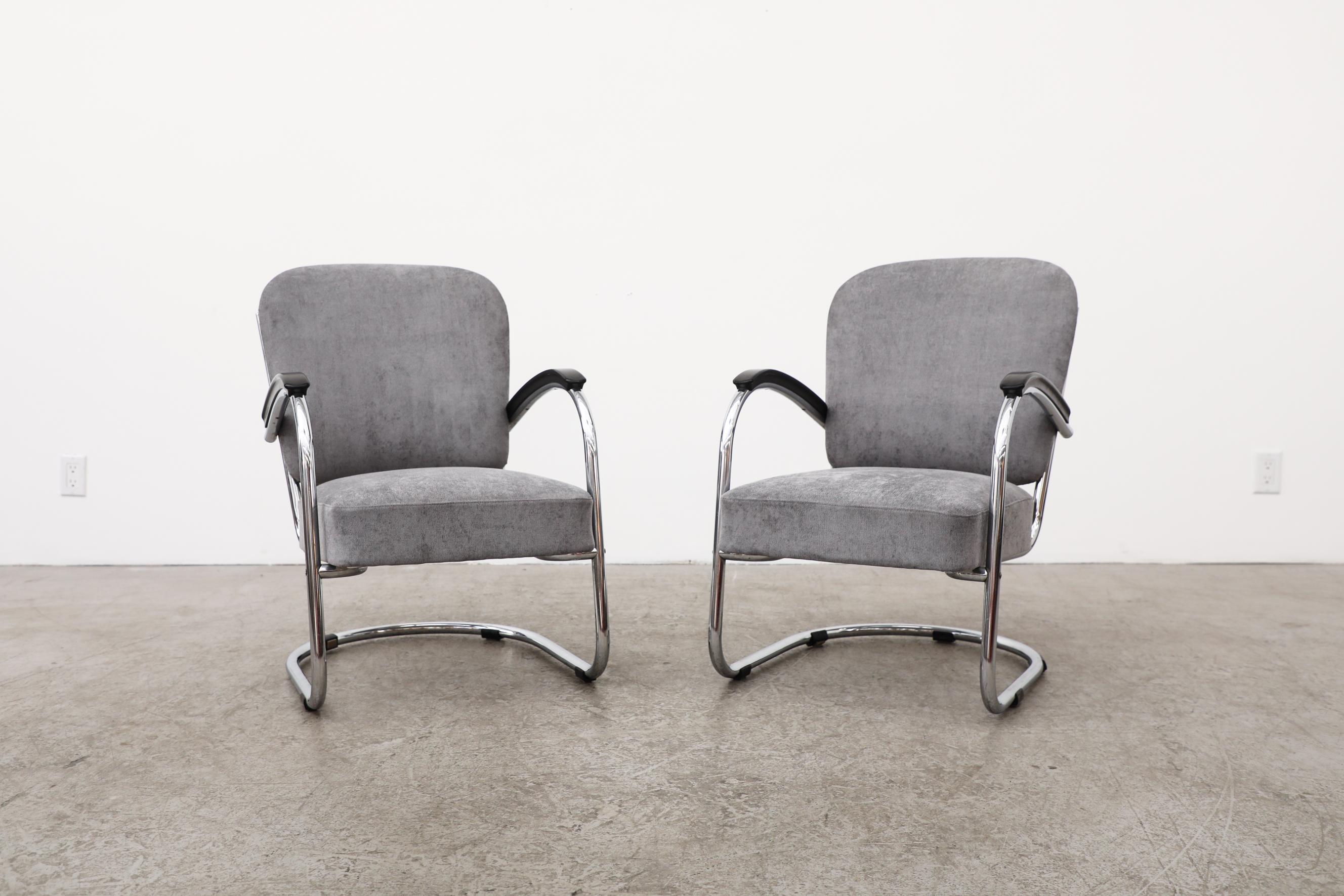This pair of model No. 436 upholstered lounge chairs, designed by Paul Schuitema, 1930's have chrome frames and bakelite armrests. Made for D3, a Rotterdam based furniture store which shuttered in 1936. The frames are in good original condition with