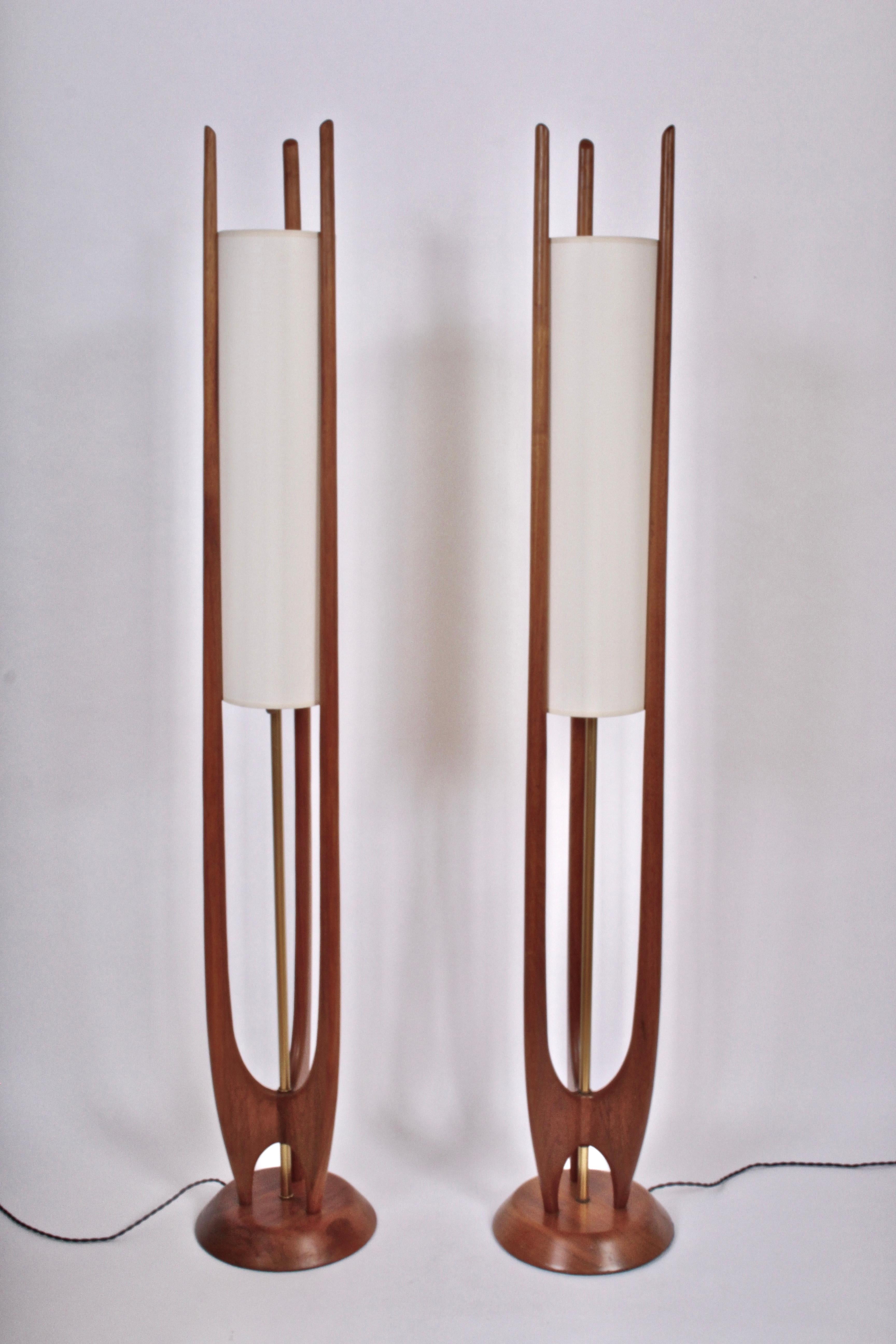Pair of Organic Modernist Modeline Lamp Co. of California Walnut and Brass detailed Floor Lamps with new 24 H x 6 D White linen shades, circa 1960. Rewired with new Brass hardware and Black braided cloth cord.