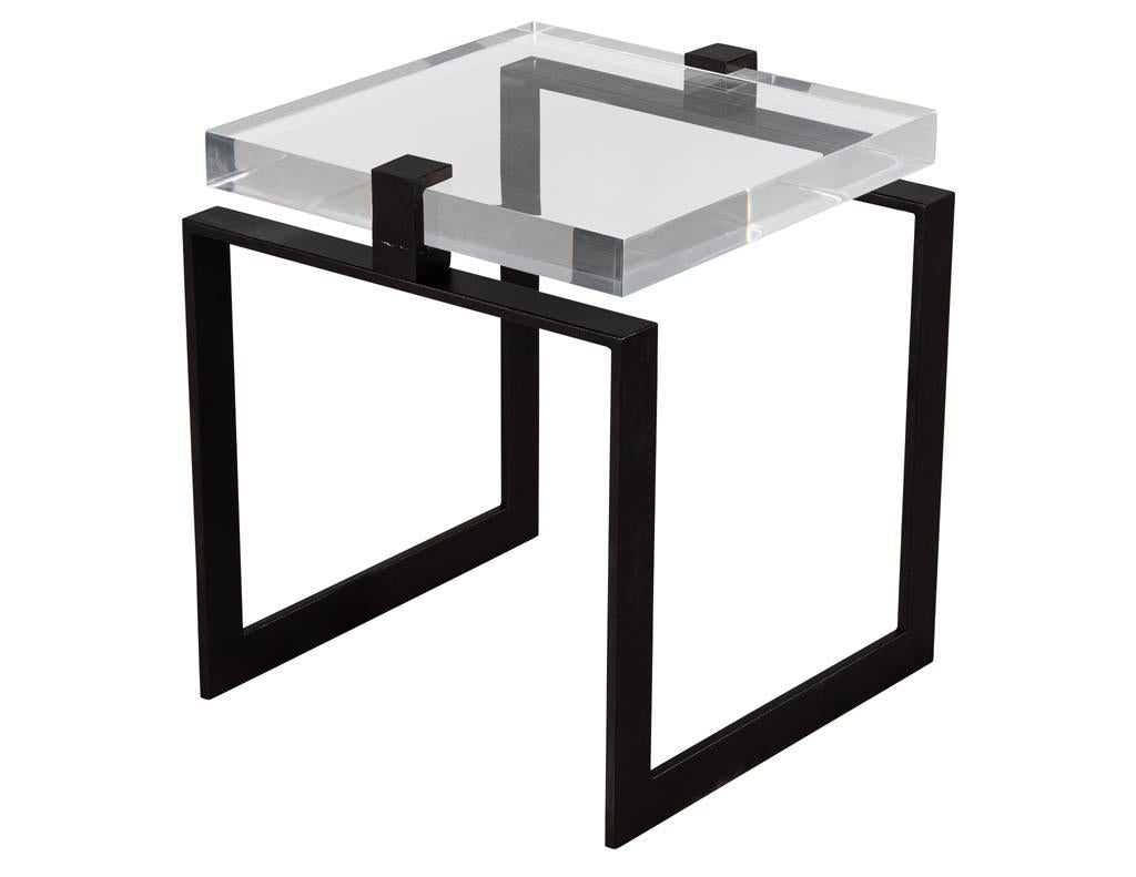Pair of modern acrylic and metal side tables. Modern unique designer end tables with a 1 ½” thick acrylic top on a black metal base.

Price includes complimentary curb side delivery to the continental USA.