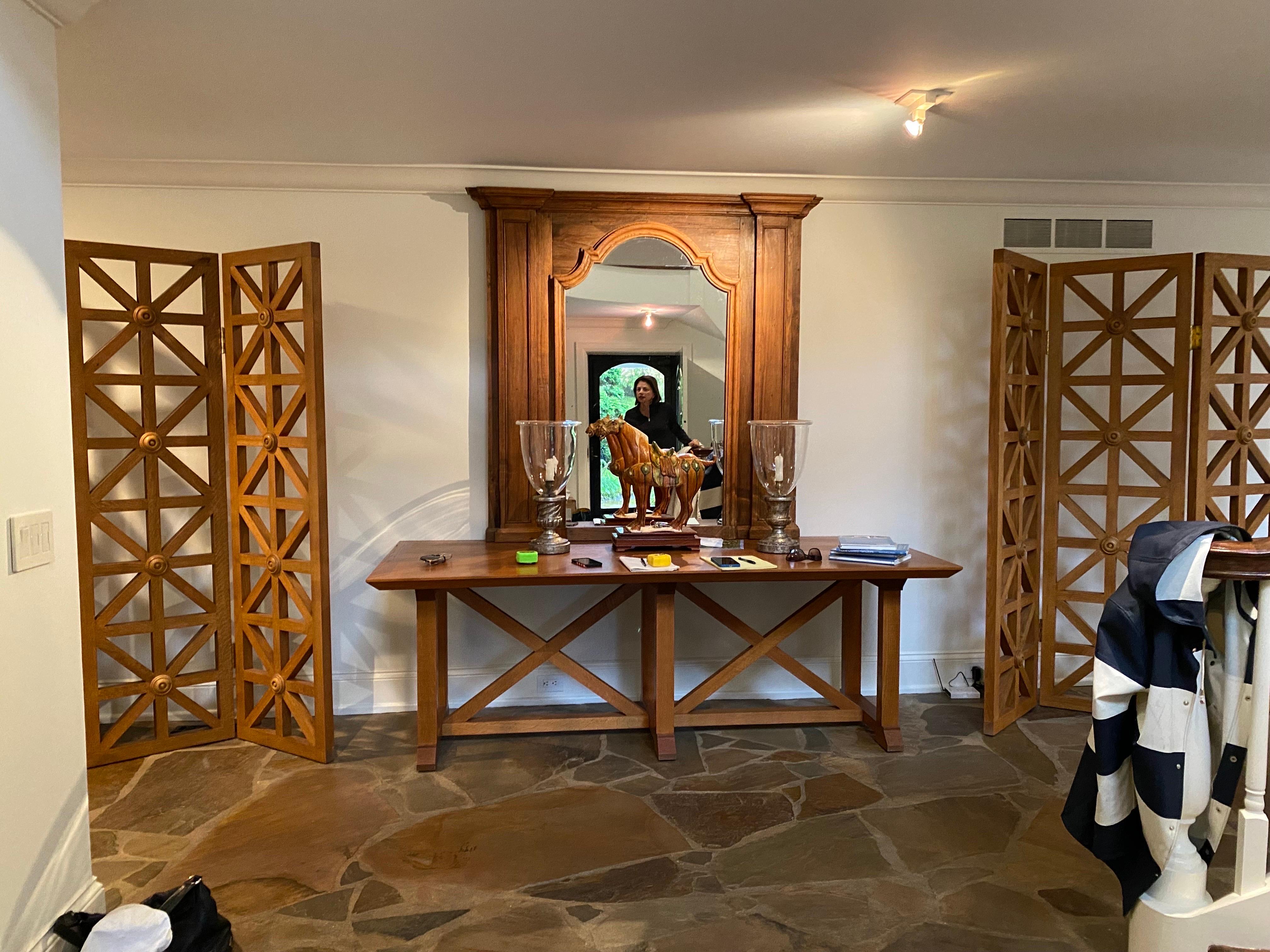 A show-stopping pair of Modern Architectural oak three panel folding screen/dividers. 
Open cut design with center medallion. Solid oak. In the light appears more of a warm honey finish and out of the light has an aged honey finish. Very good