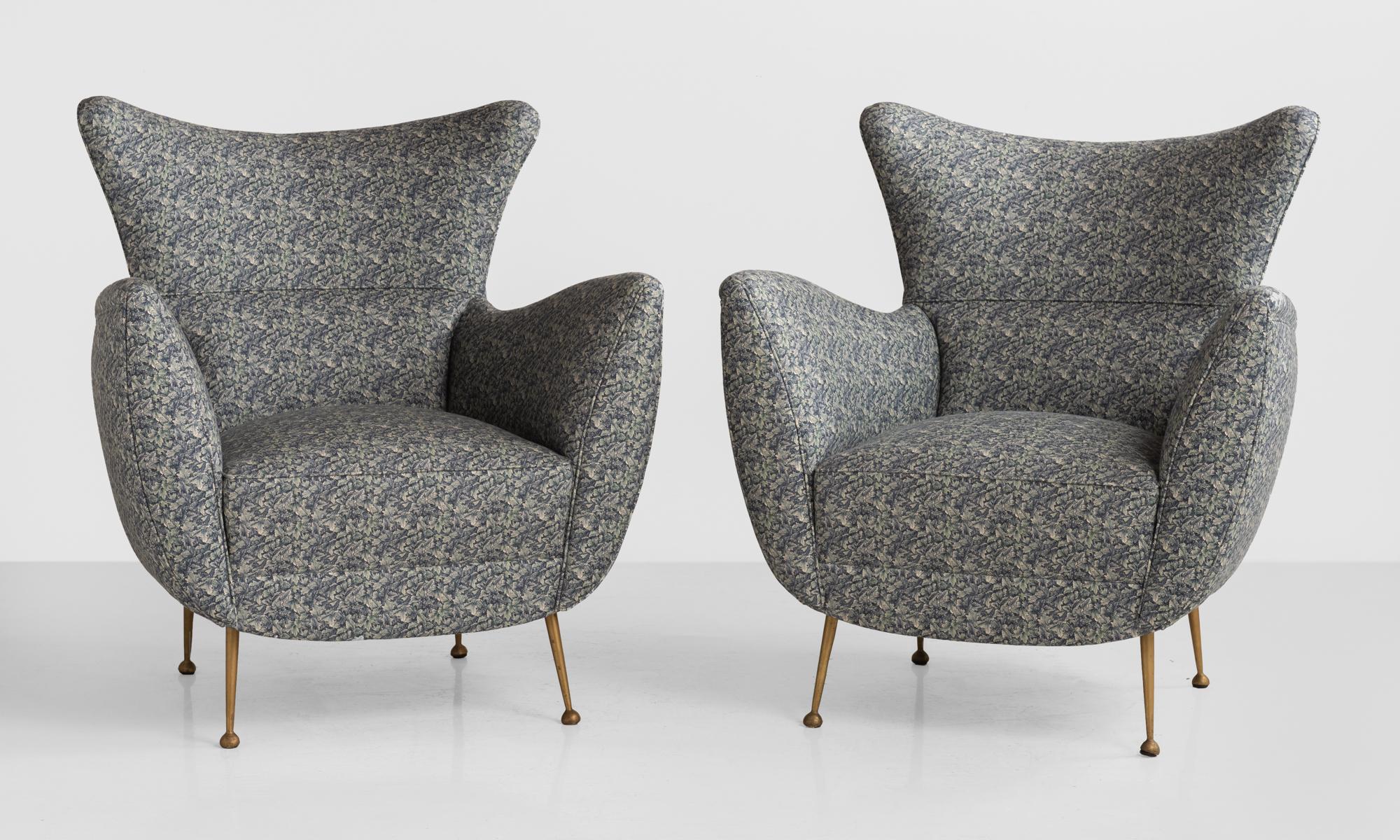 Pair of modern armchairs, circa 1950

Curved back and sloping arms on brass legs. Newly upholstered in liberty of London fabric.
