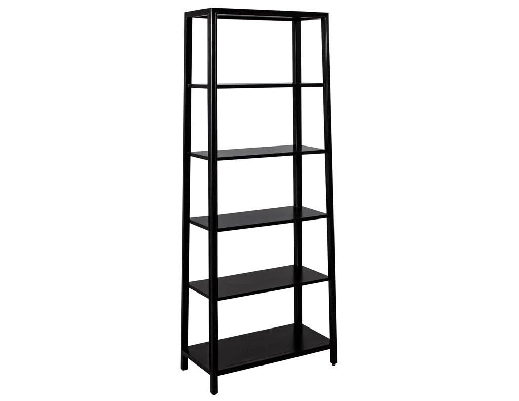 Pair of modern black bookcases in solid wood. Finished in a satin black finish with sleek modern styling. Sold in a pair, 4 total available.

Price includes complimentary scheduled curb side delivery to the continental USA.