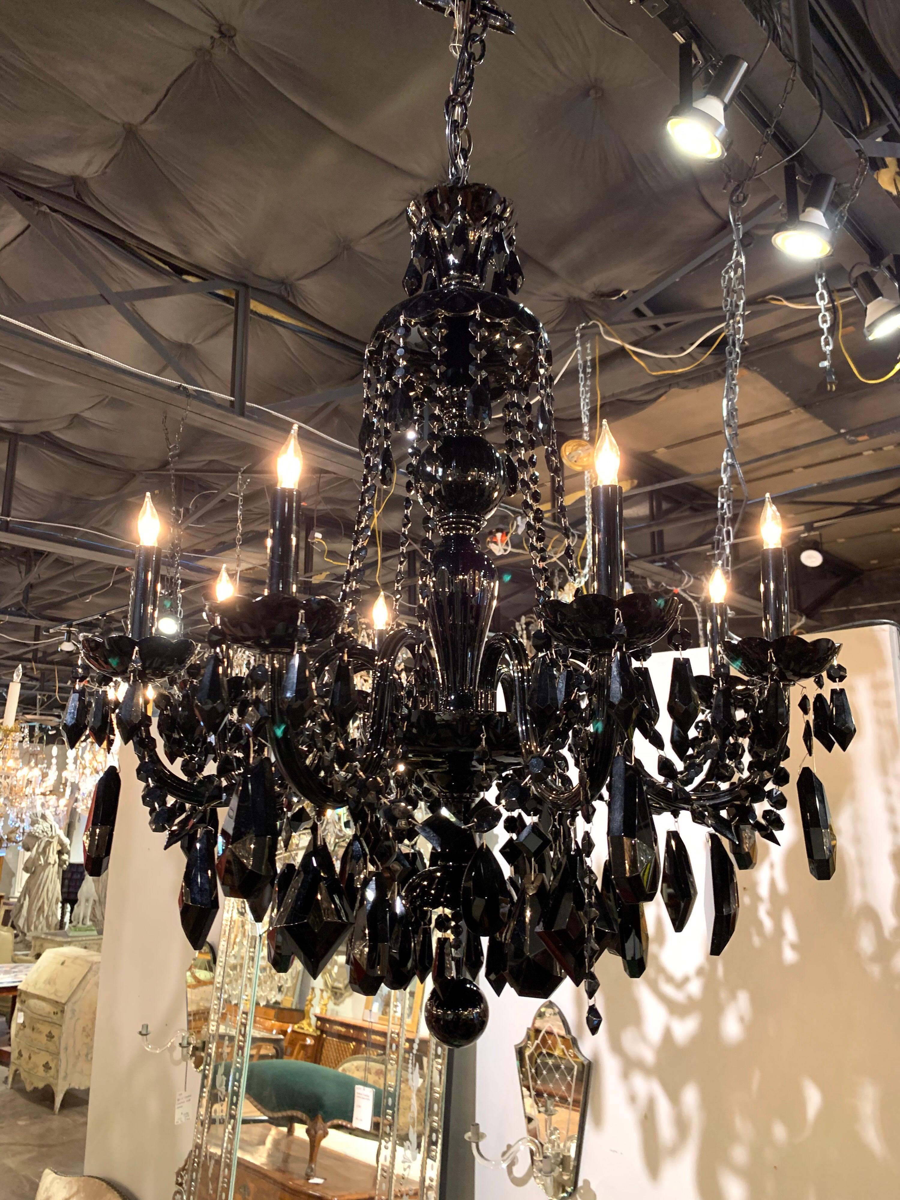 Very striking modern pair of black crystal chandeliers with 8-light. Large array of glistening beads and crystals. This unique pair would be wonderful for an upscale design!