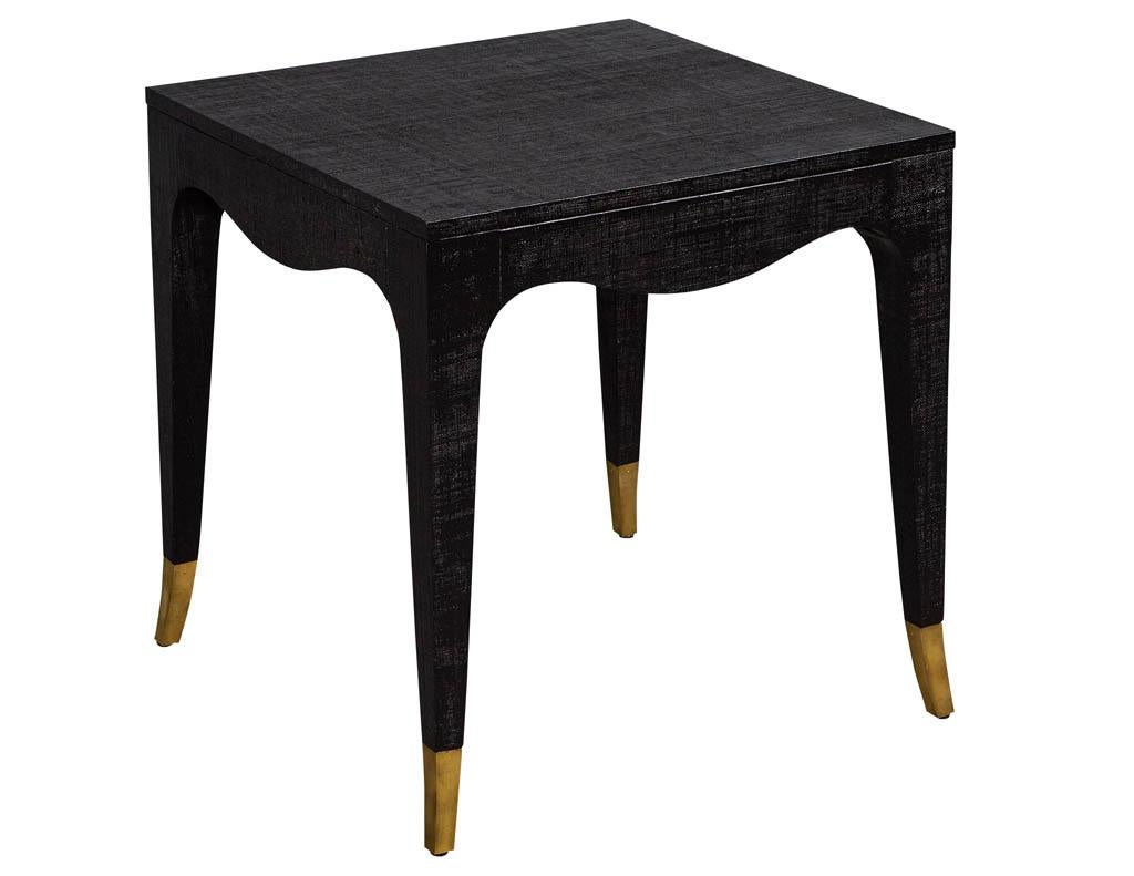 Pair of modern black linen clad side tables. Featuring clean curved lines and brass capped feet.

Price includes complimentary curb side delivery to the continental USA.