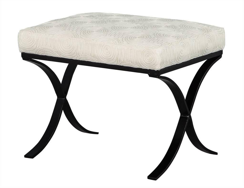 These 21st century ottomans are a bold lesson in contrast. They sit atop very Fine, black metal bases with fresh off-white embroidered fabric cushion tops. Dainty yet comfortable, this set is in excellent condition and perfect for a chic home.