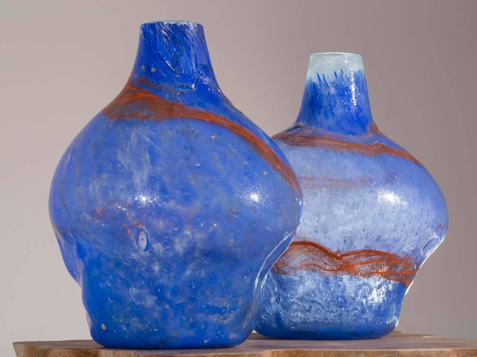 A pair of modern handblown glass vases with blue and orange decoration from Holland. Because each vase is handblown they have a different shape while being the same height. Please take a moment to enlarge the photographs to see the appealing shape