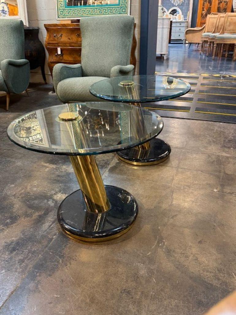 This product is a stylish pair of modern brass tables with black lacquered base with glass tops. The sleek design and use of materials give these tables a timeless yet contemporary feel. Perfect for a designer look! Gorgeous!
28w x 21.5h