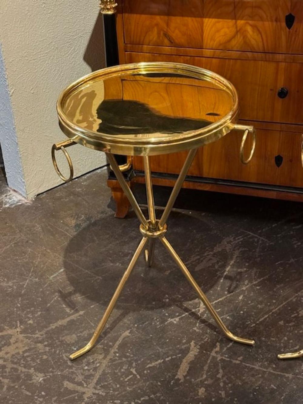 Elegant pair of modern brass drink tables after Jean Michael Frank. Makes a beautiful statement!!