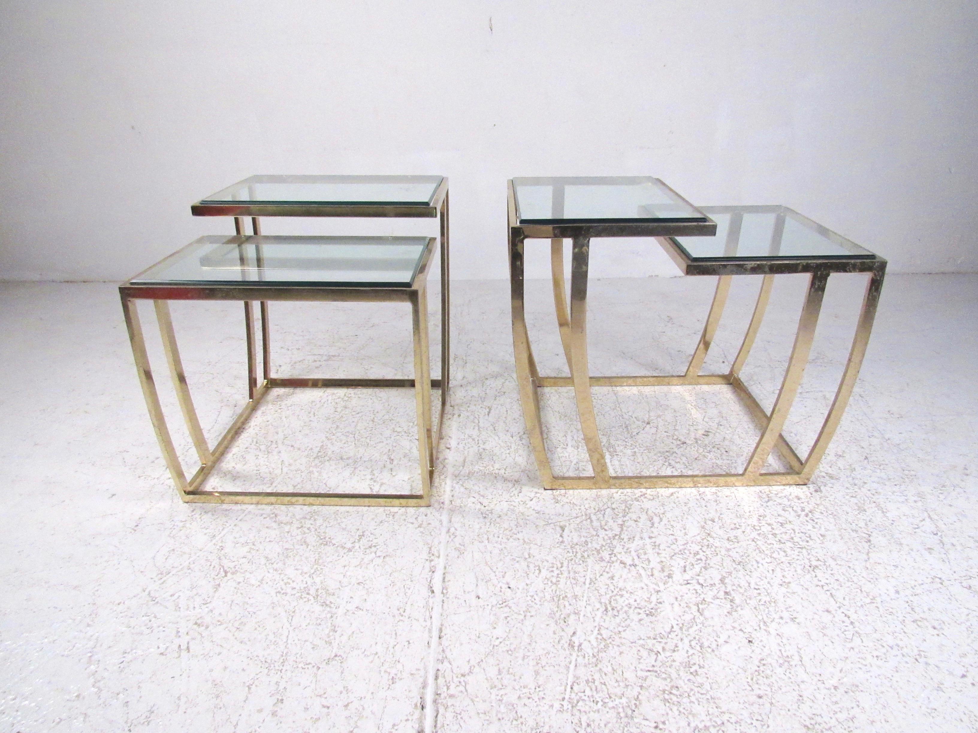 This stylish pair of two-tier end tables adds a unique vintage modern display table to living room or office seating arrangements. Perfect split level table for use as a lamp table or simple side table. The vintage brass plated finish is worn in