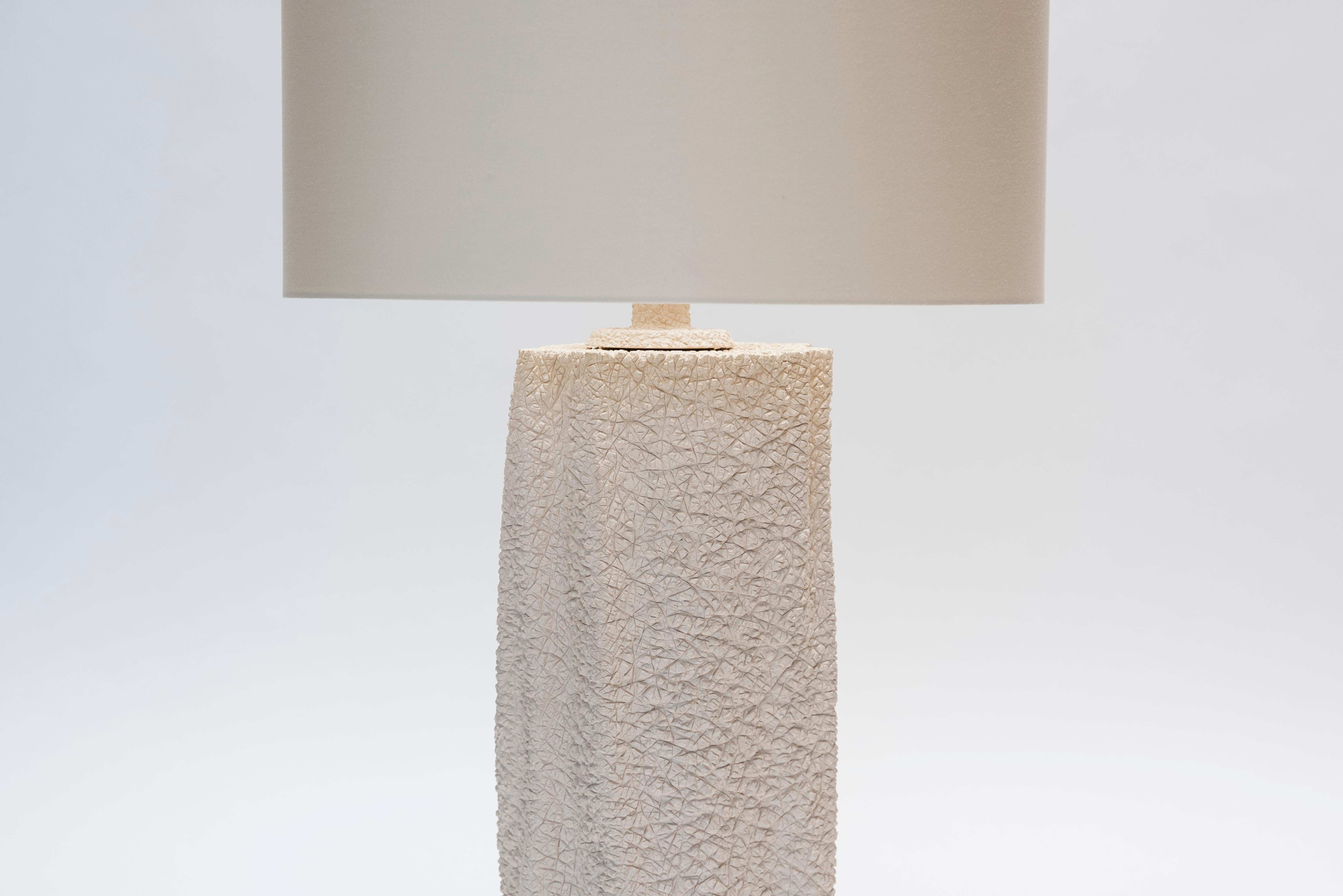 Pair of french modern table lamps in natural ceramic, with an interesting texture mixing tree bark and reptile skin.
