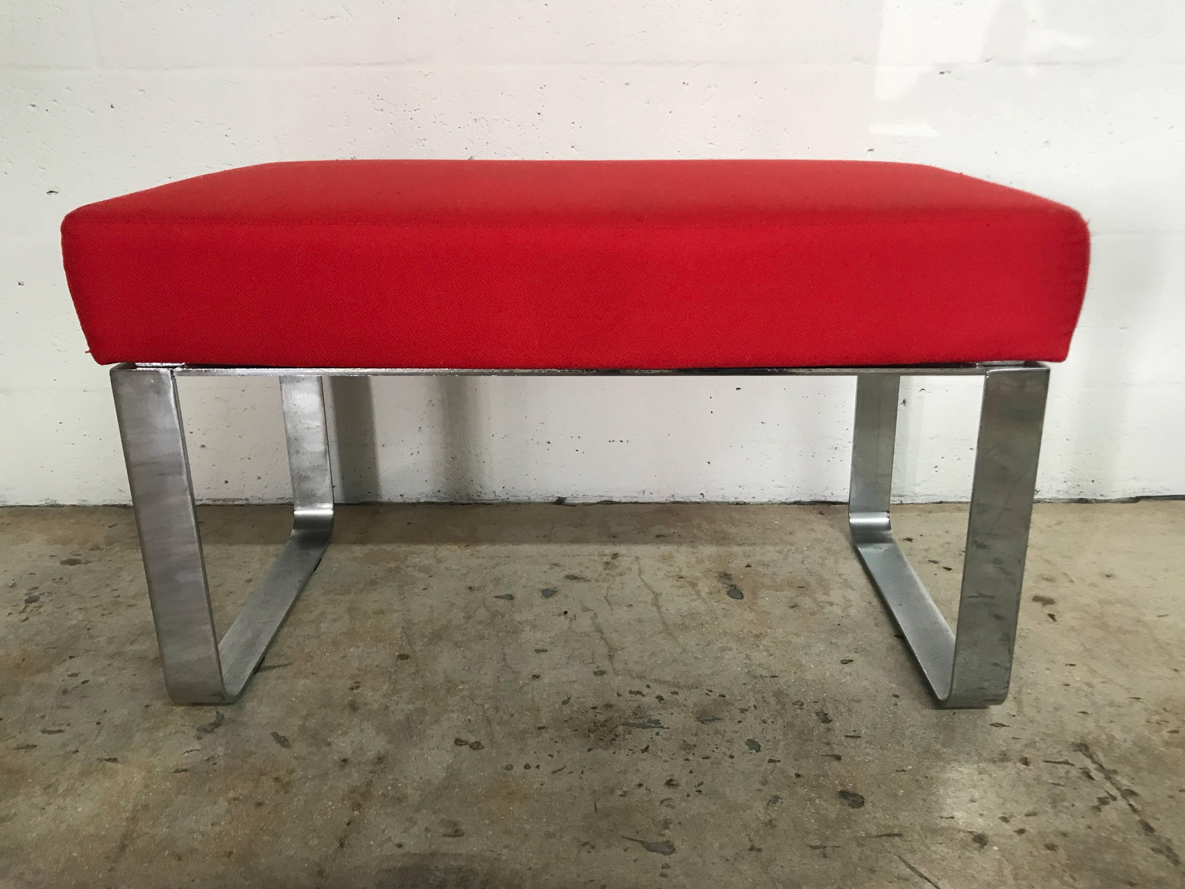 Stylish bench in chrome and red fabric.

Pair available, sold individually 
